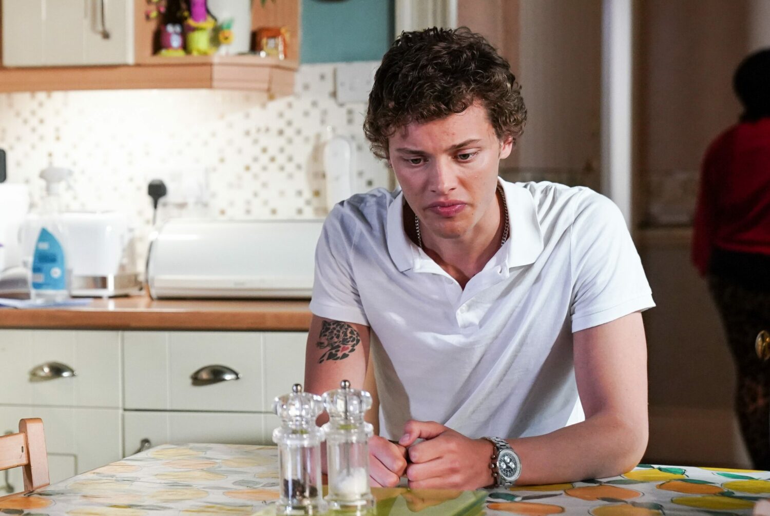 EastEnders' Freddie is sitting at the kitchen table, upset