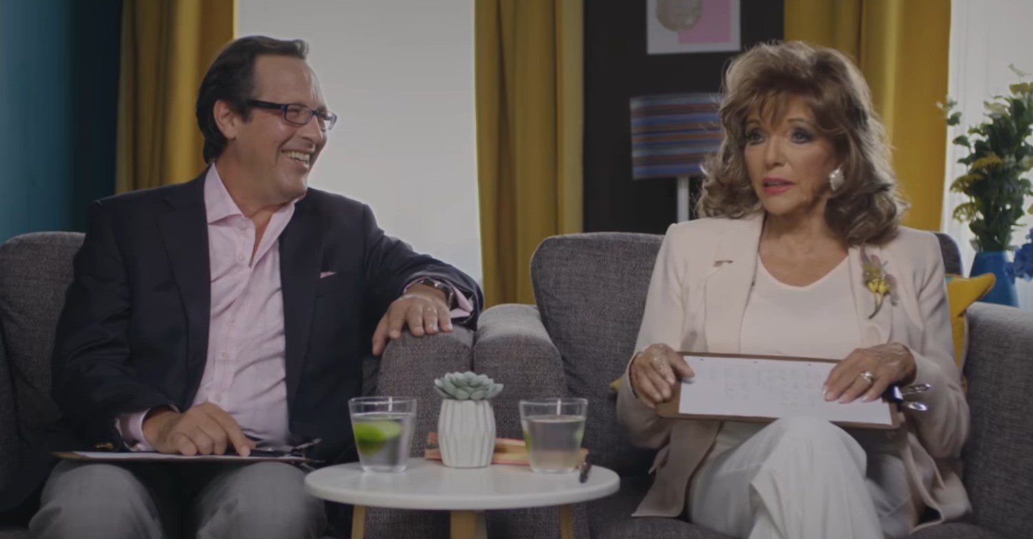 Joan Collins sitting with husband Percy