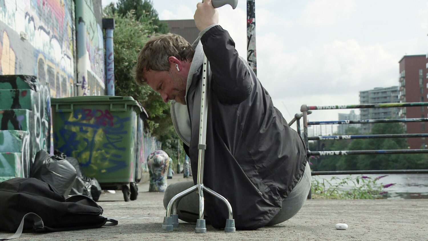 Coronation Street's Paul is on the ground outside whilst holding on to his walking aid