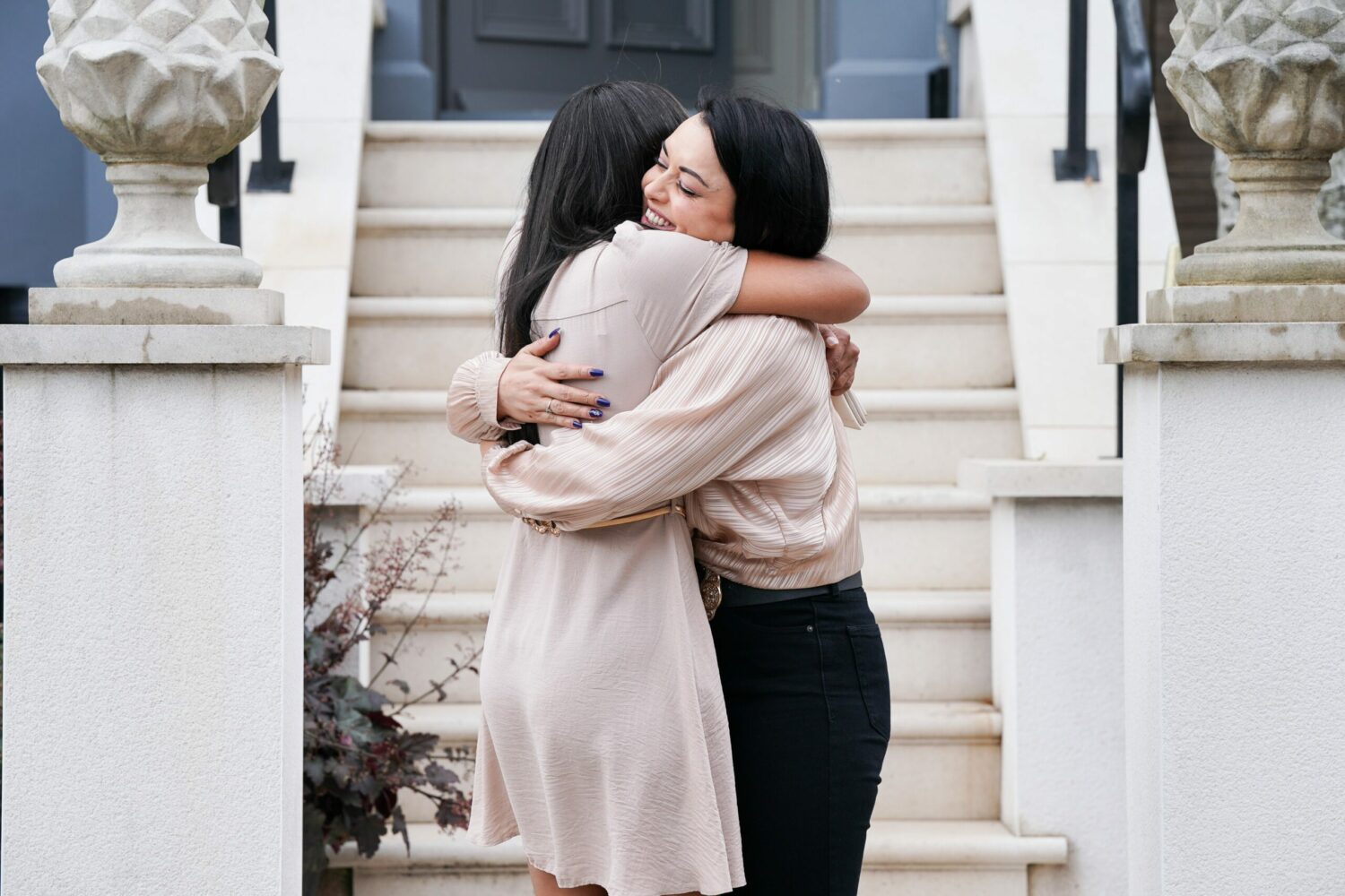 EastEnders' Chelsea and Whitney are hugging outside