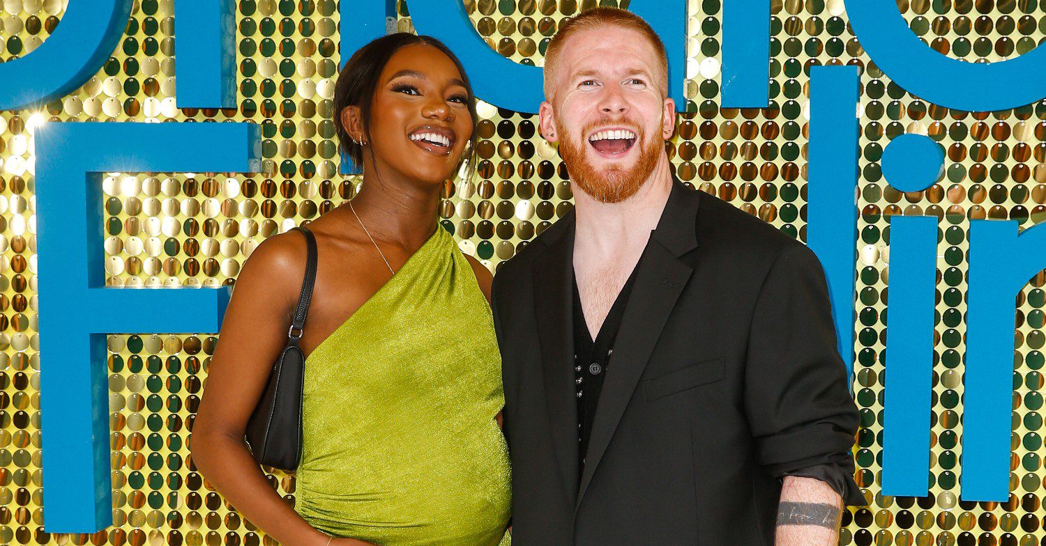 Strictly Come Dancing professional Neil Jones and Love Island star Chyna Mills smiling at a movie premiere