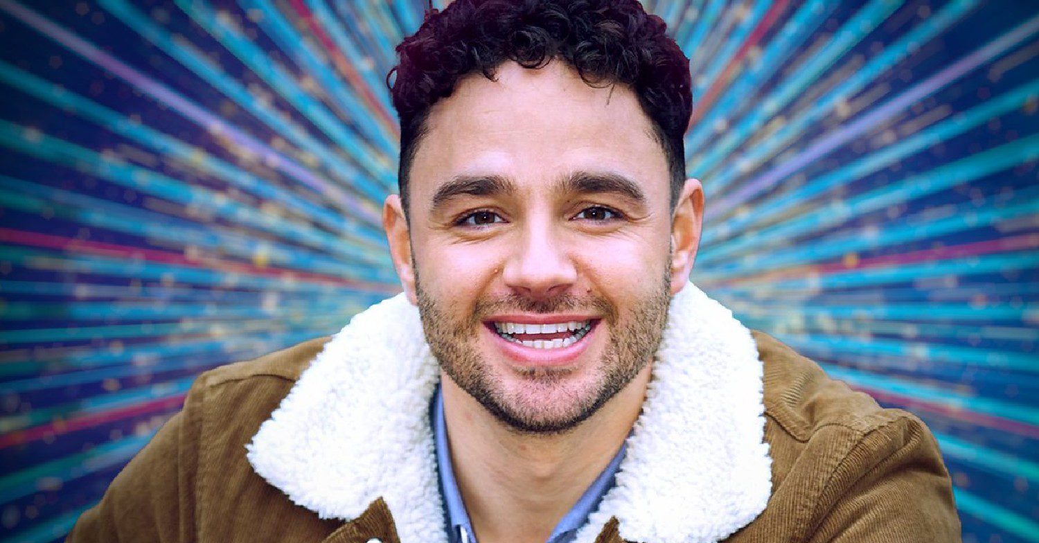Adam Thomas smiling in Strictly promo pic