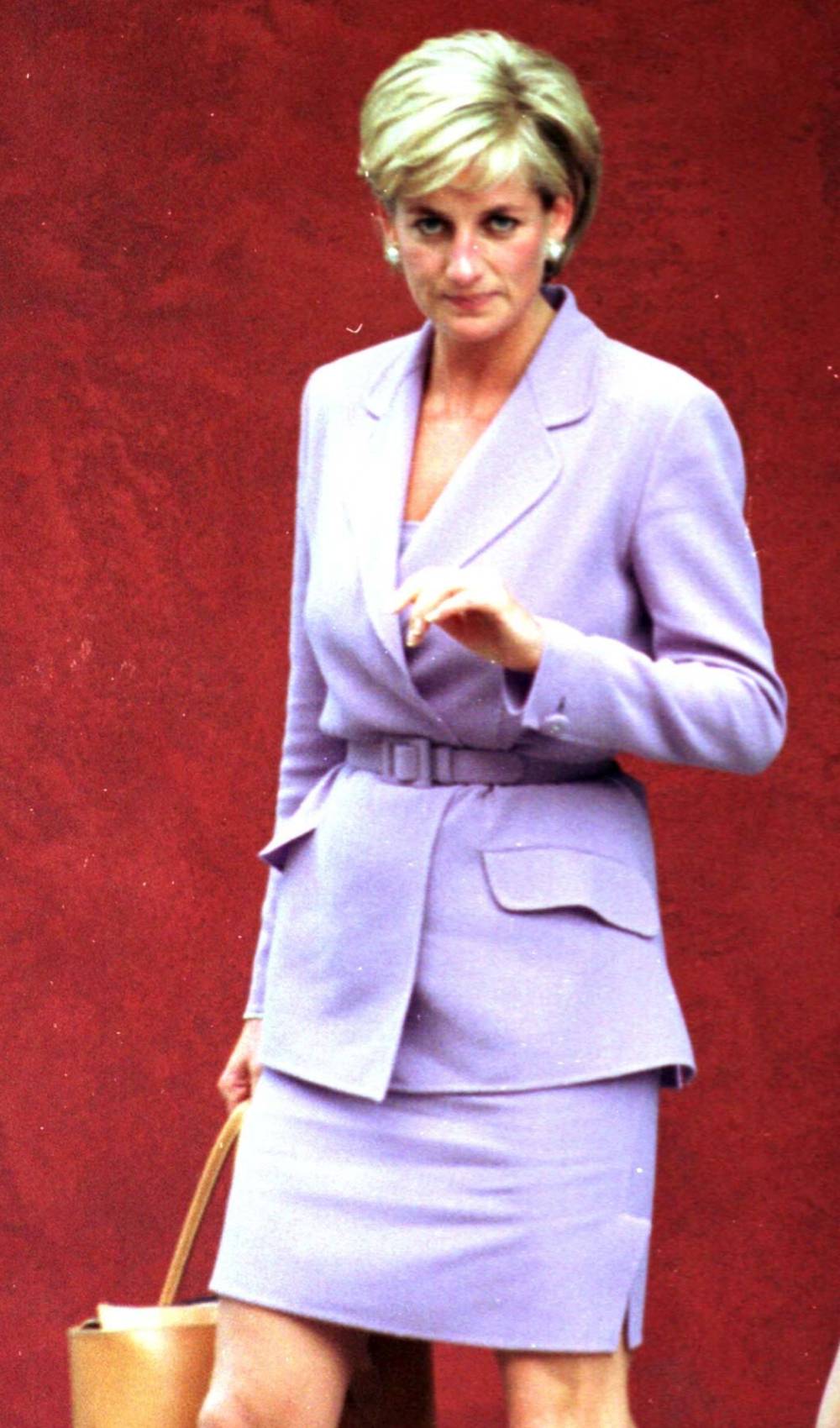 Princess Diana carries a handbag