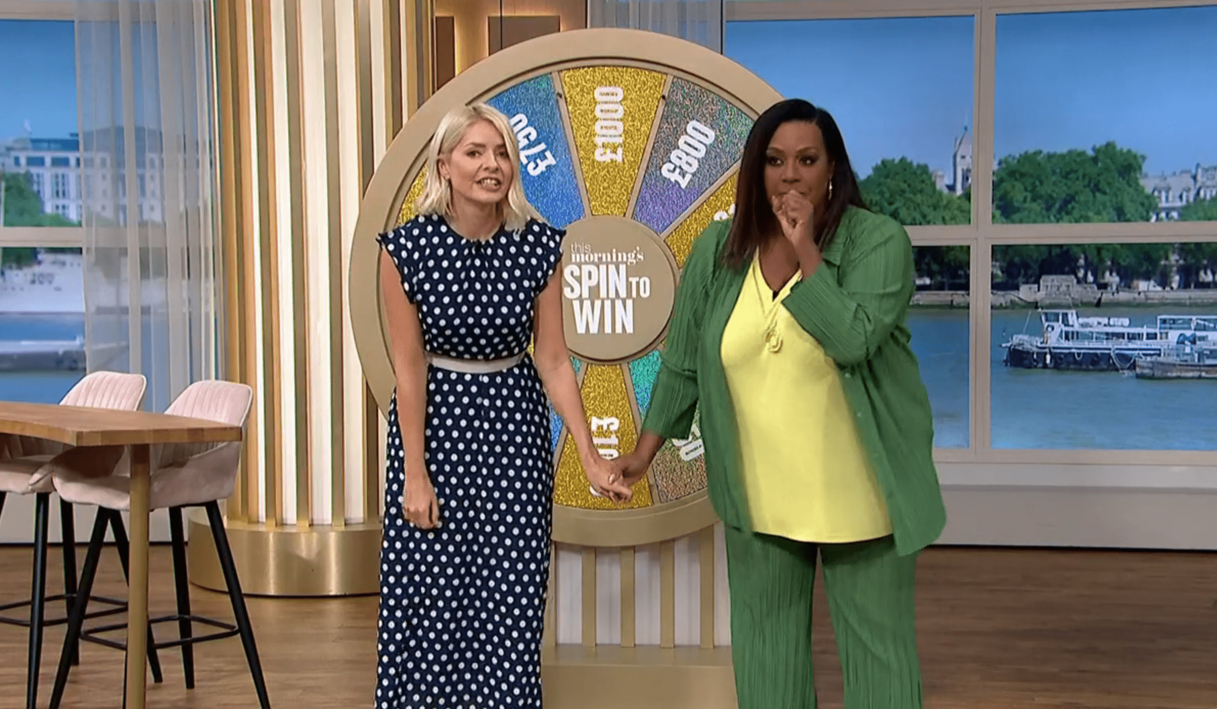Holly Willoughby and Alison Hammond holding hands on This Morning