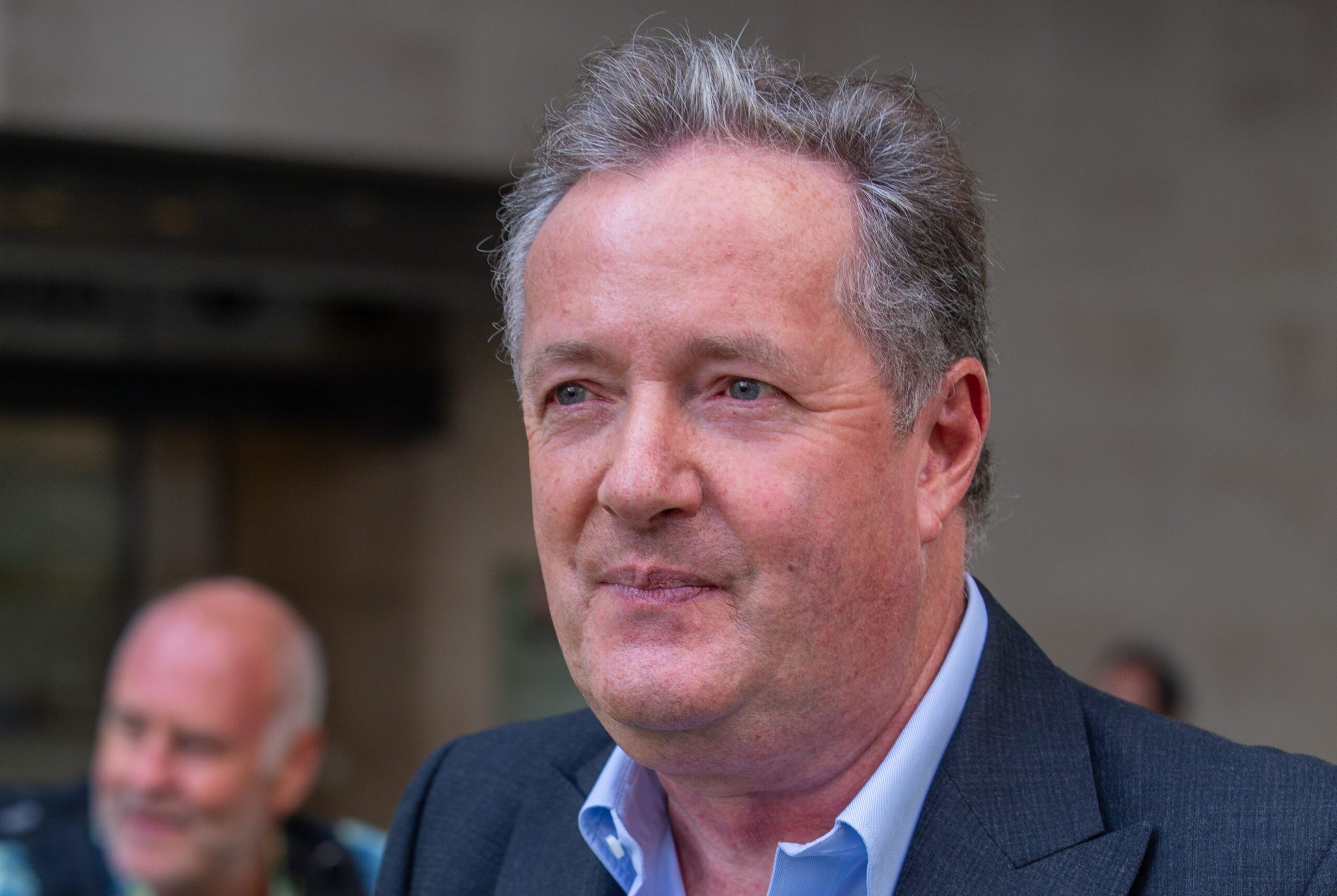 Piers Morgan smiling
