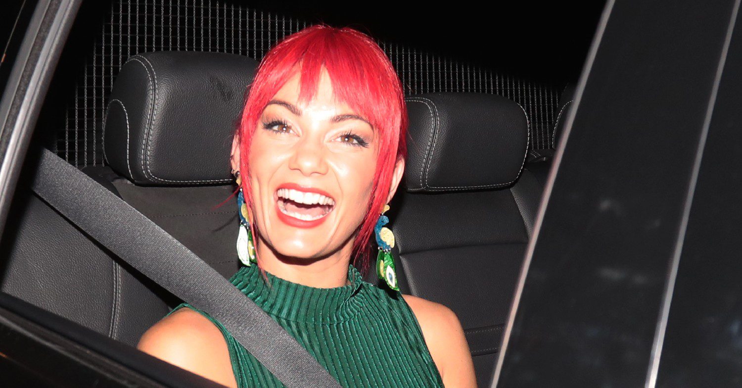 Dianne Buswell smiling in a car
