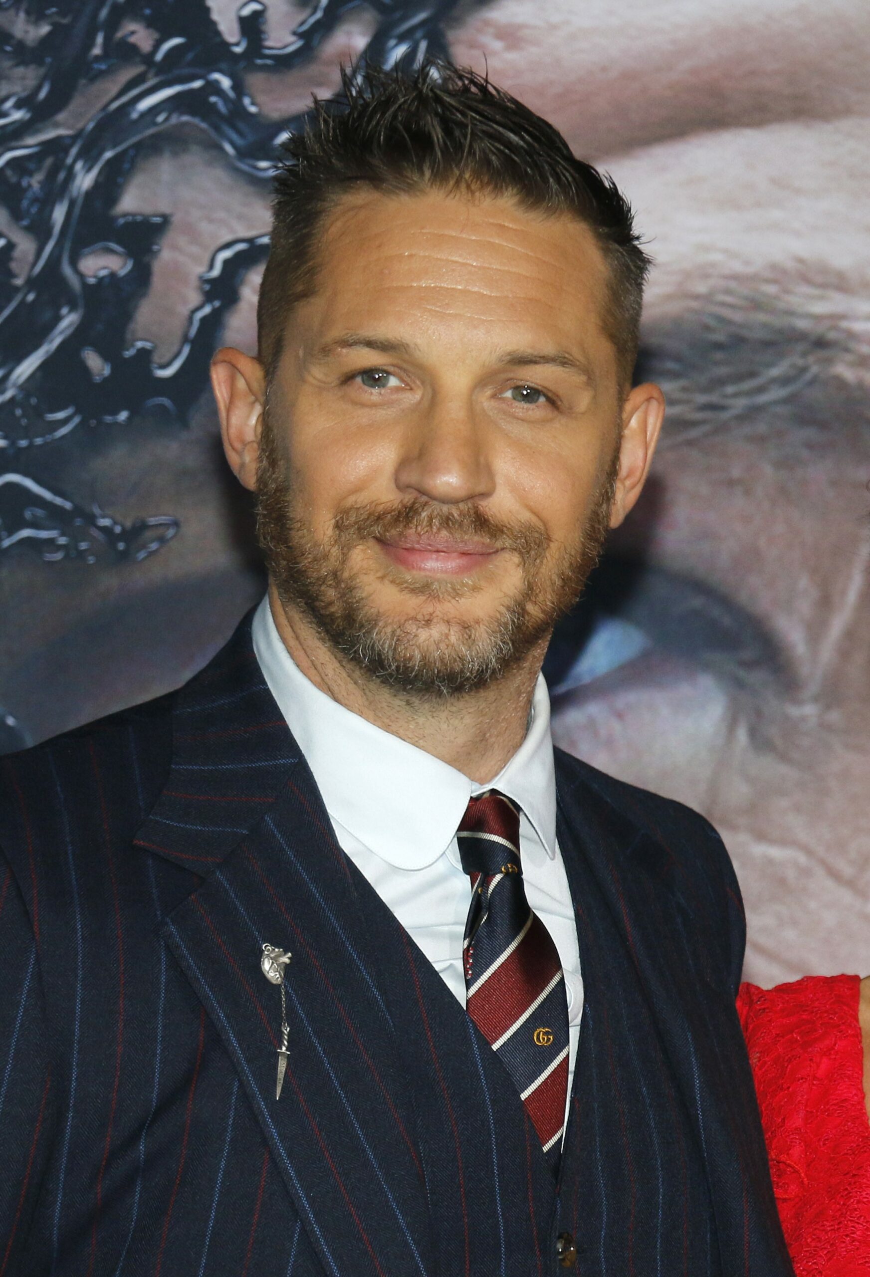 Tom Hardy smiling at event