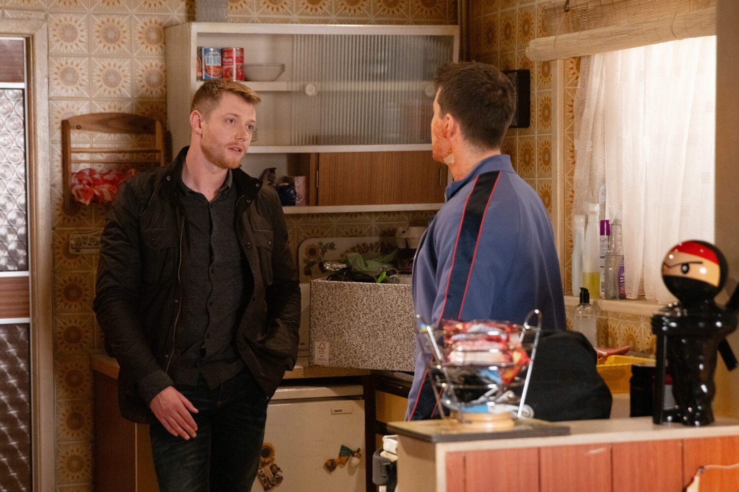 Coronation Street's Daniel and Ryan are speaking in the flat kitchen