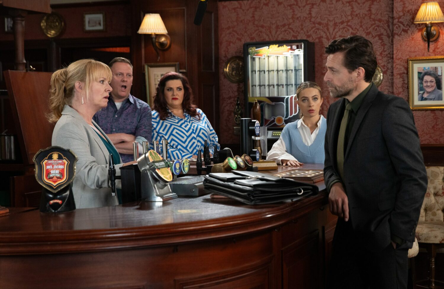 Jenny, Sean, Glenda and Daisy in the Rovers Return looking shocked at the Waterfords rep