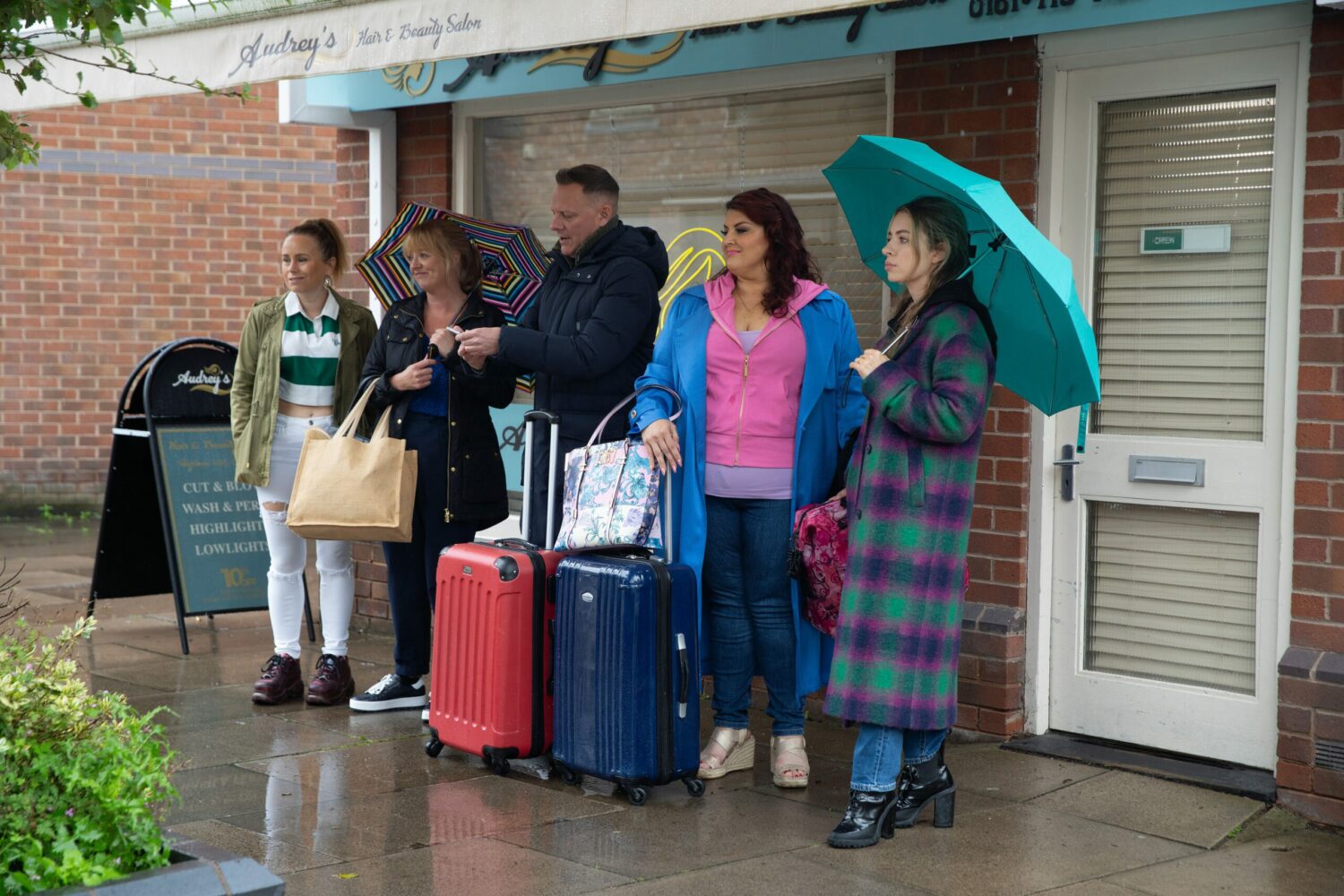 Jenny and the Rovers team watch sadly as the pub is closed