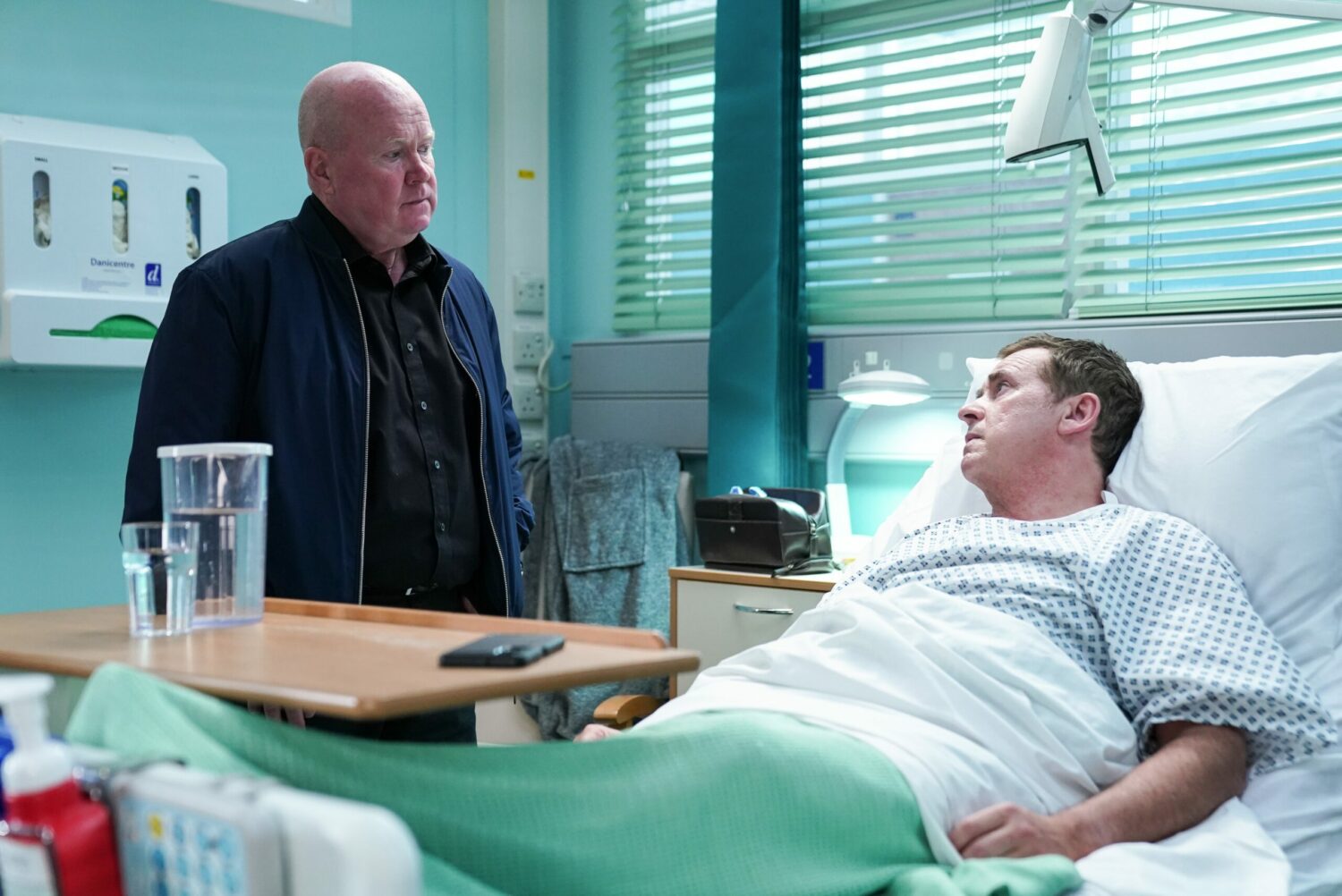 Phil Mitchell visits Alfie Moon in hospital after his operation