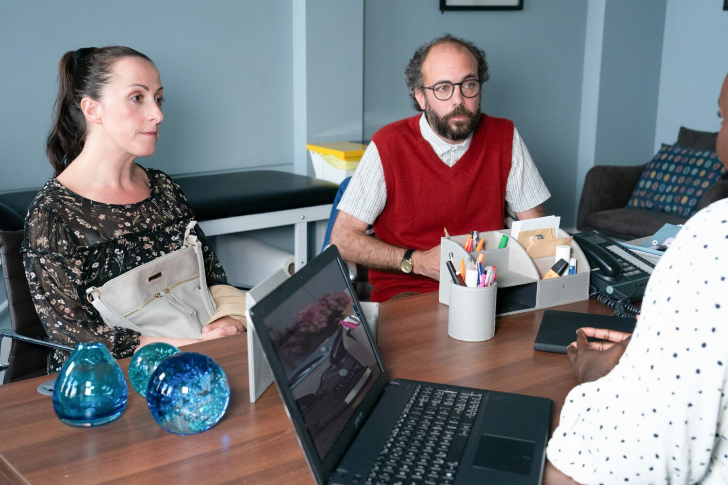 Sonia and Reiss look stressed in the doctors office