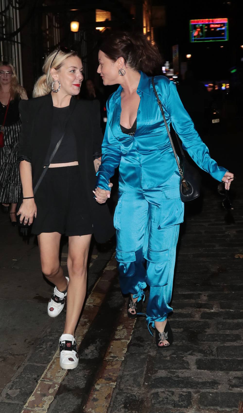 Sheridan Smith walks down a street with Jaime Winstone