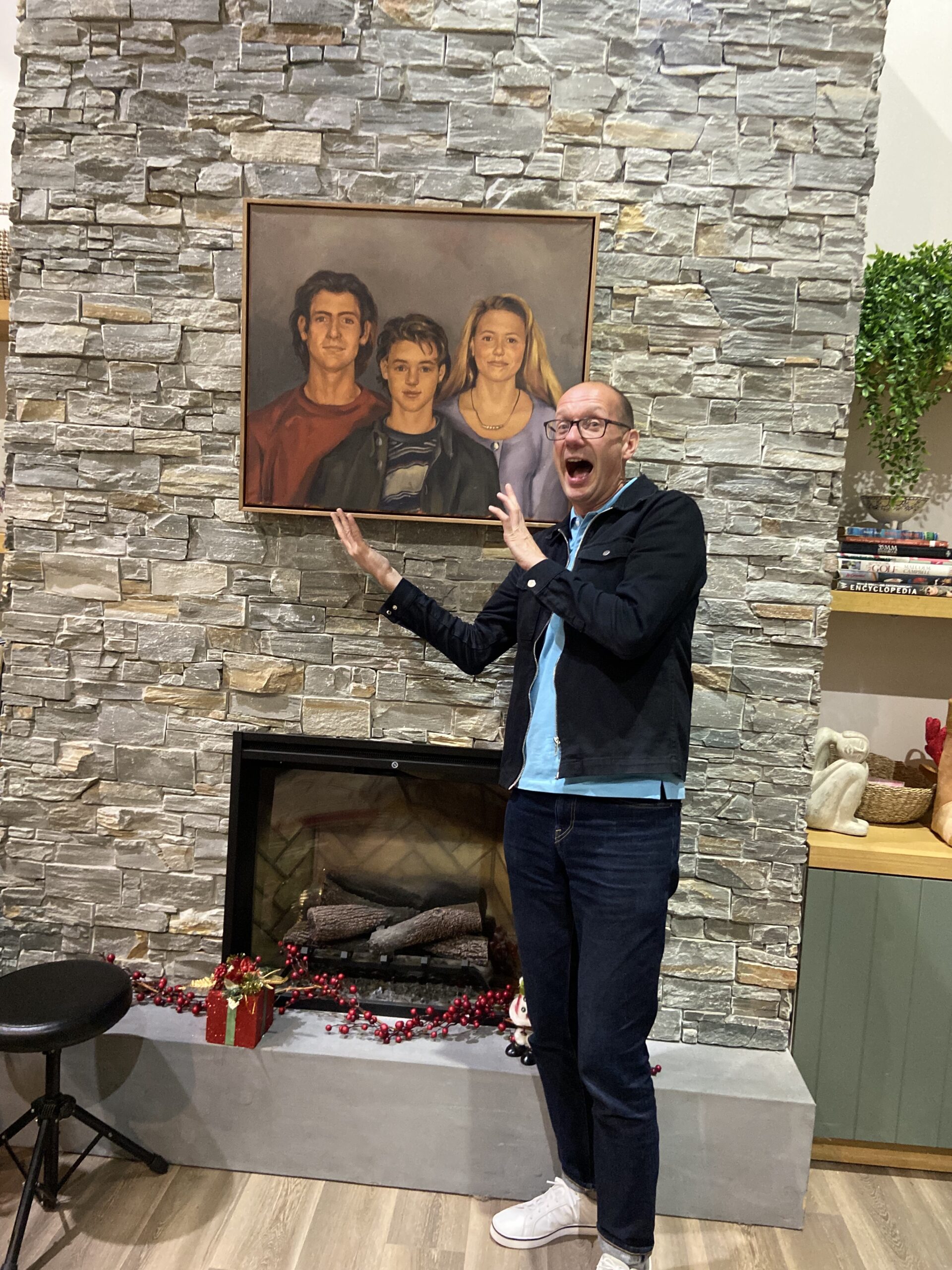 Steven Murphy smiles excitedly at the Kennedy kids' portrait in Neighbours