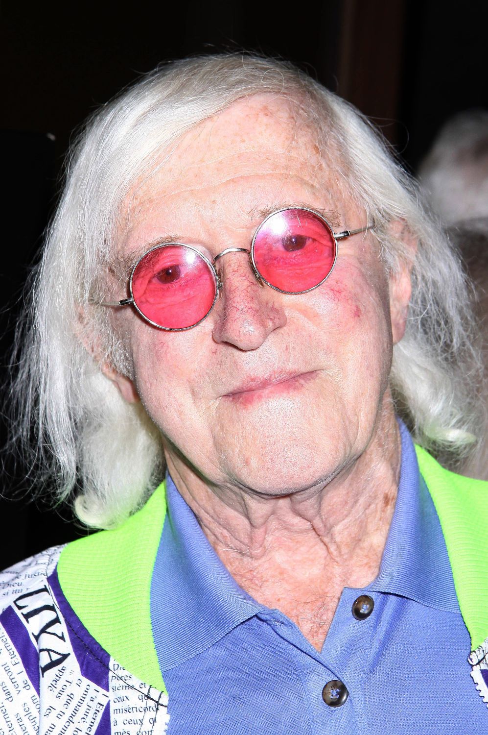Jimmy Savile smiles smugly