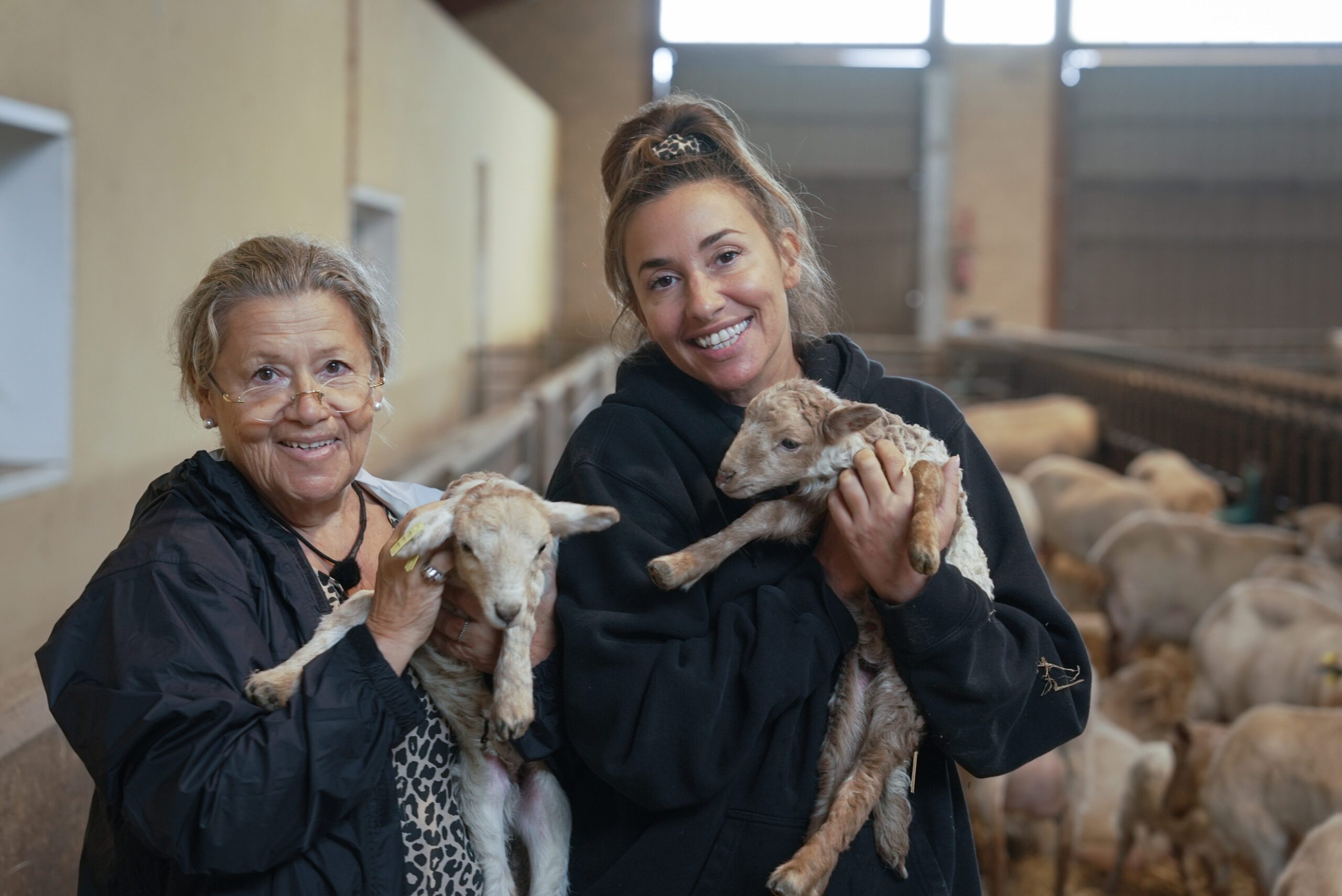 Melanie Blatt and her mum cuddle lambs on Celebrity Race Across the World