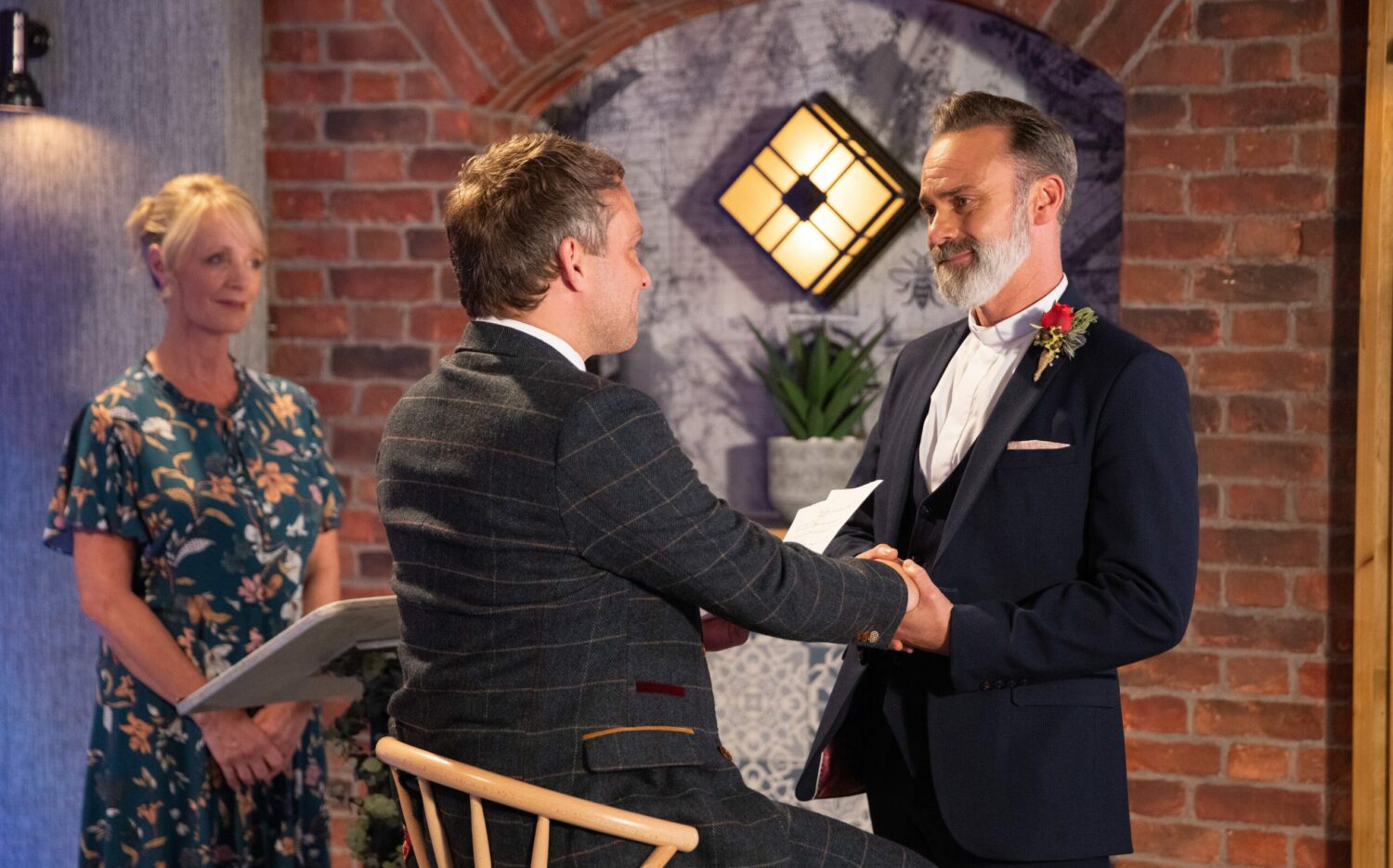 Coronation Street's Paul and Billy are holding hands at their wedding