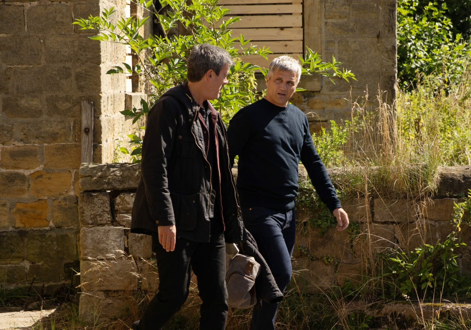 Cain and Caleb walking on the farm in Emmerdale