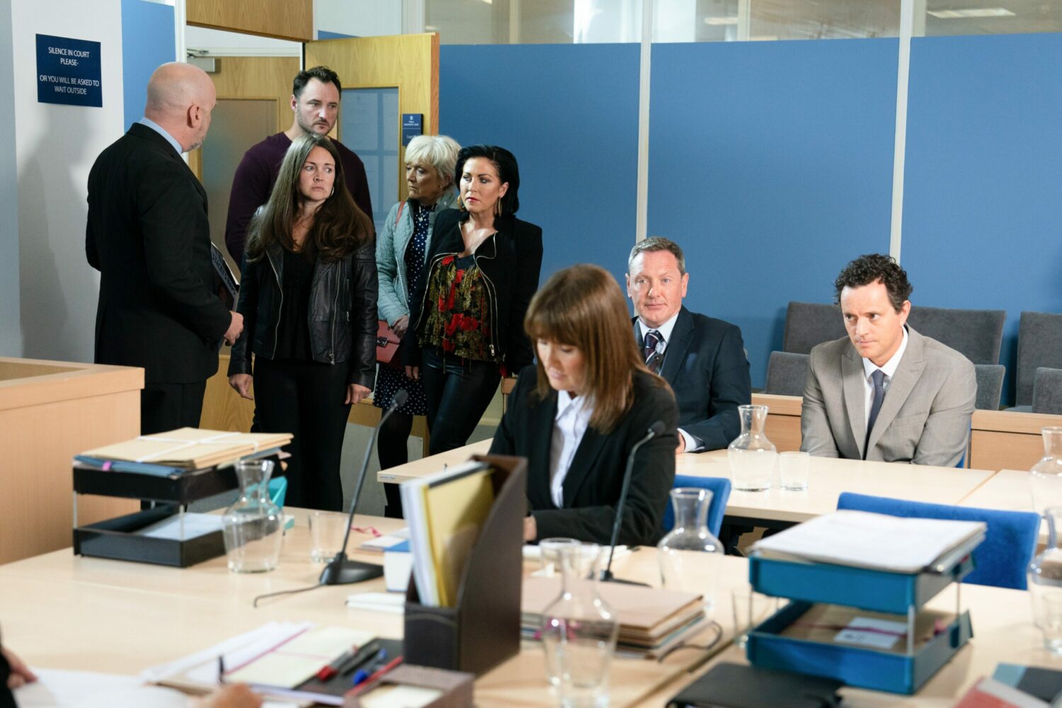 Stacey, Martin, Jean and Kat burst into the court room looking stressed in EastEnders