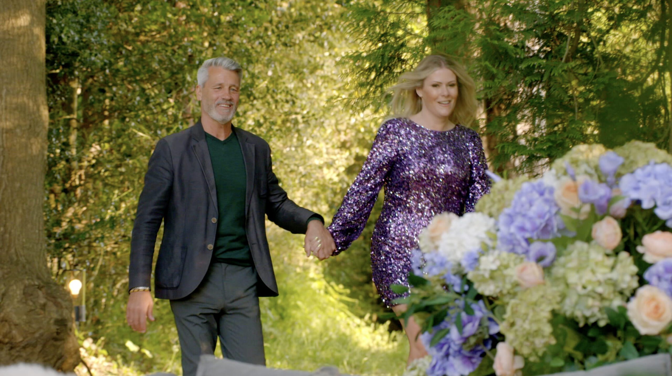 Roger and Janey holding hands on My Mum Your Dad