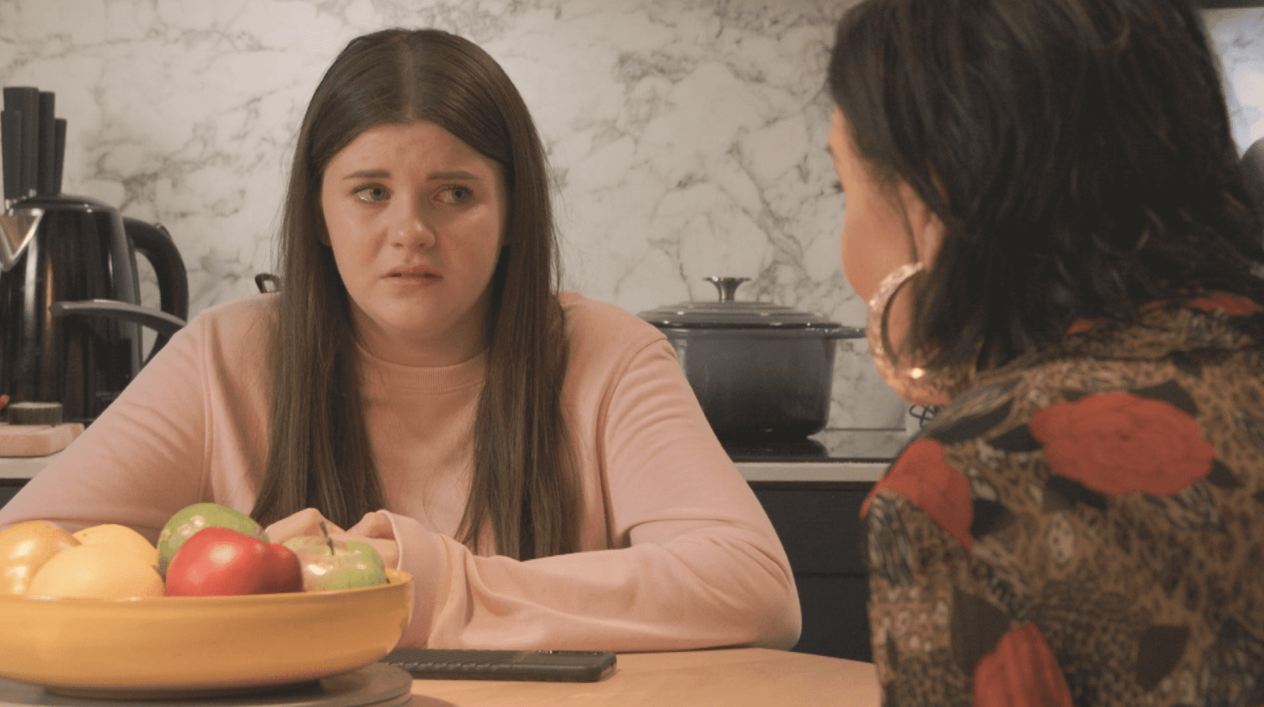 Lily Slater crying as Kat Mitchell talks to her