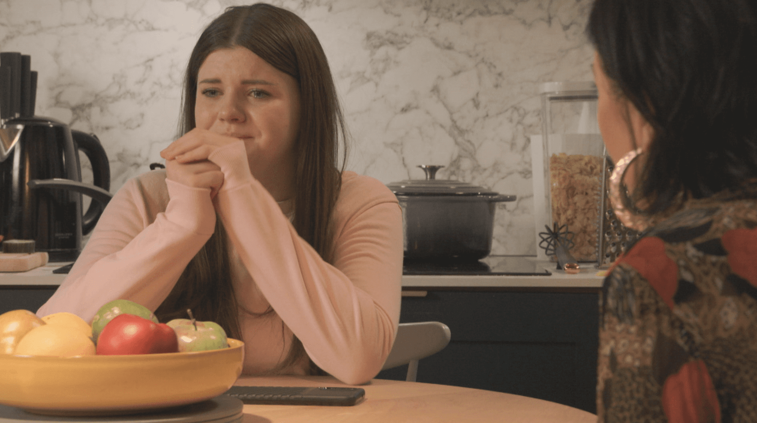 Lily Slater crying as Kat Mitchell talks to her