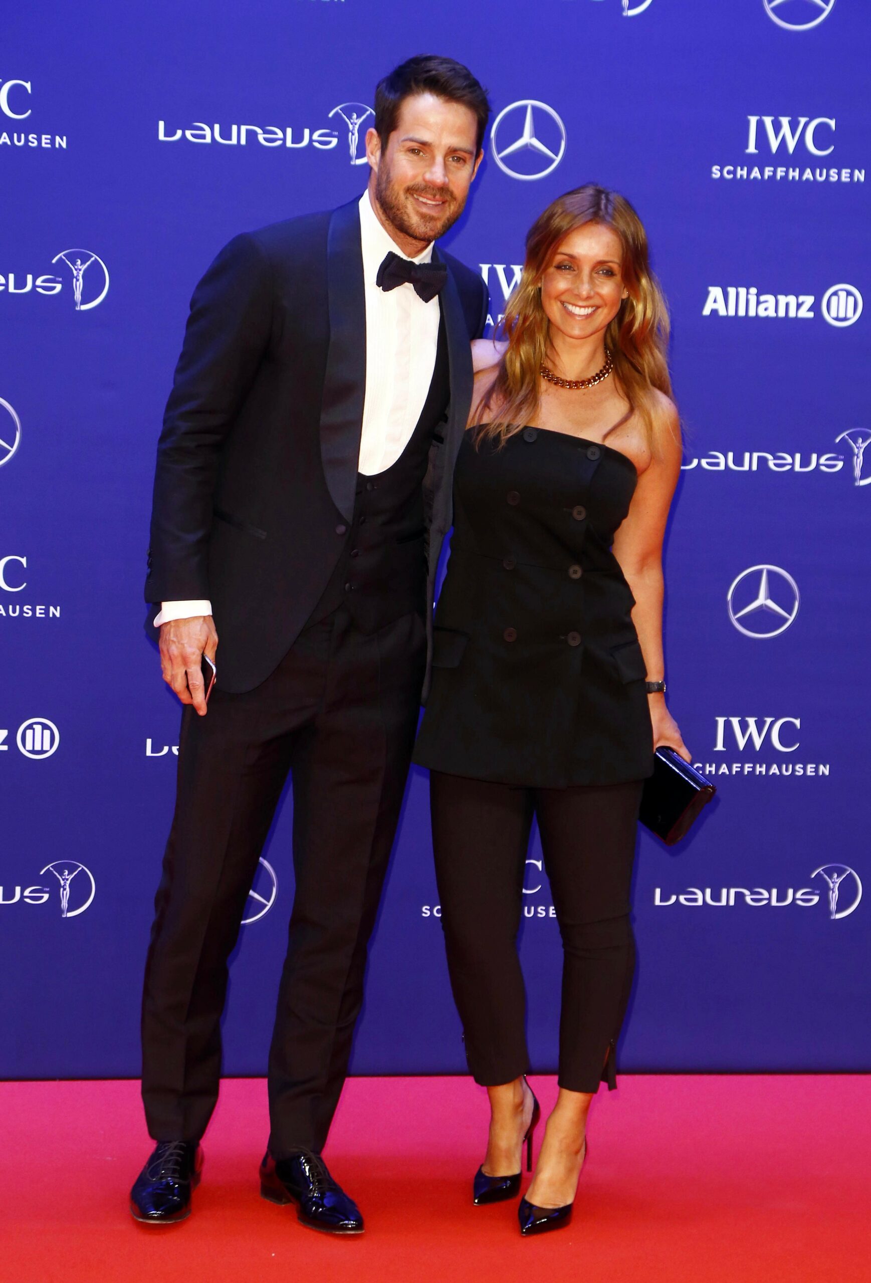 Jamie and Louise Redknapp posing at event