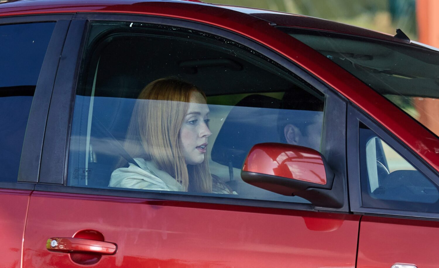 Chloe in Emmerdale is driving a car looking stressed