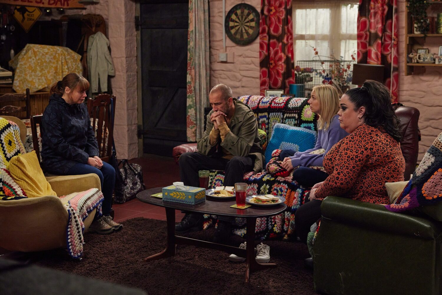 Lydia talking to the Dingles at home on Emmerdale