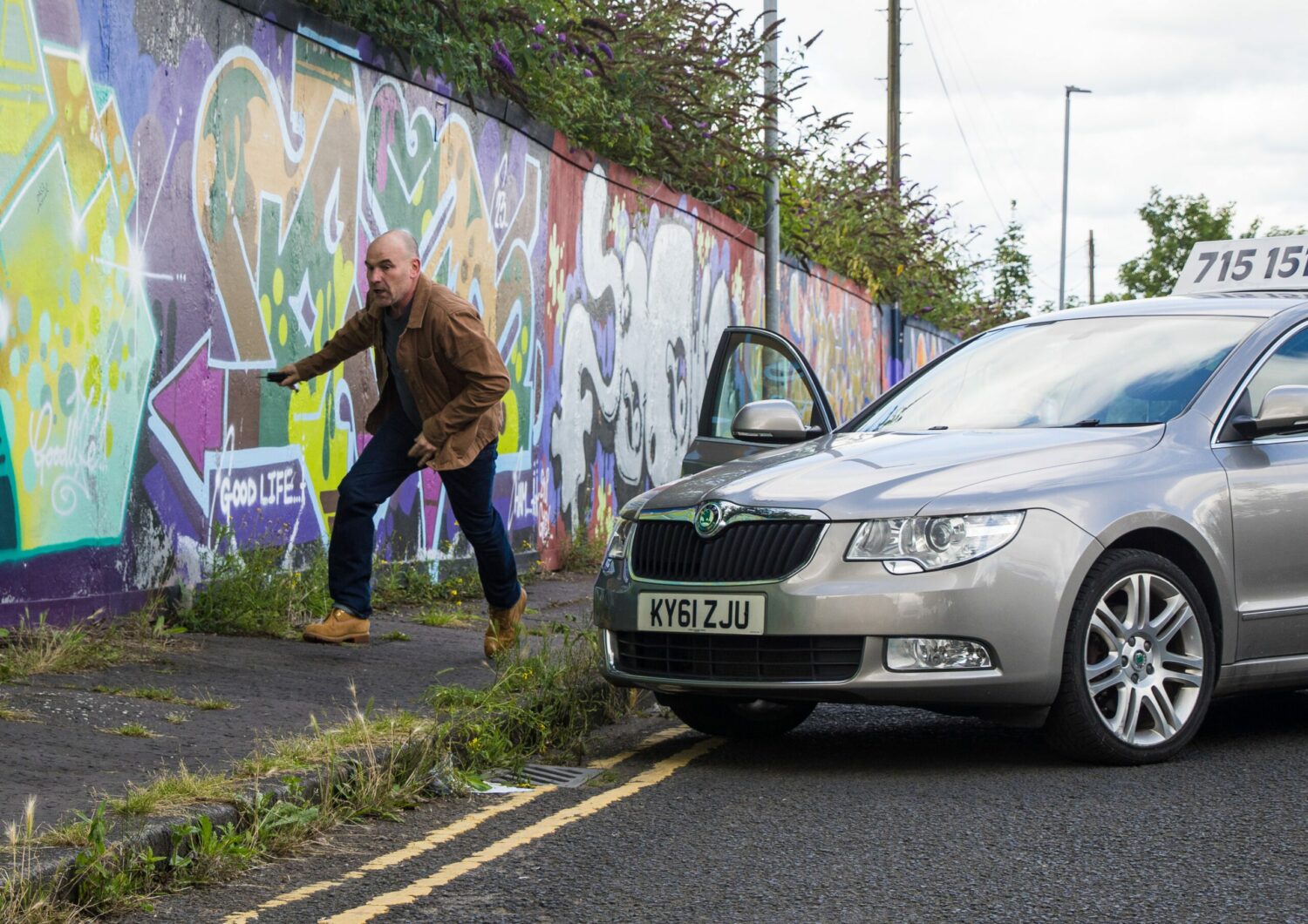 Tim in Coronation Street rushes out of the car and runs