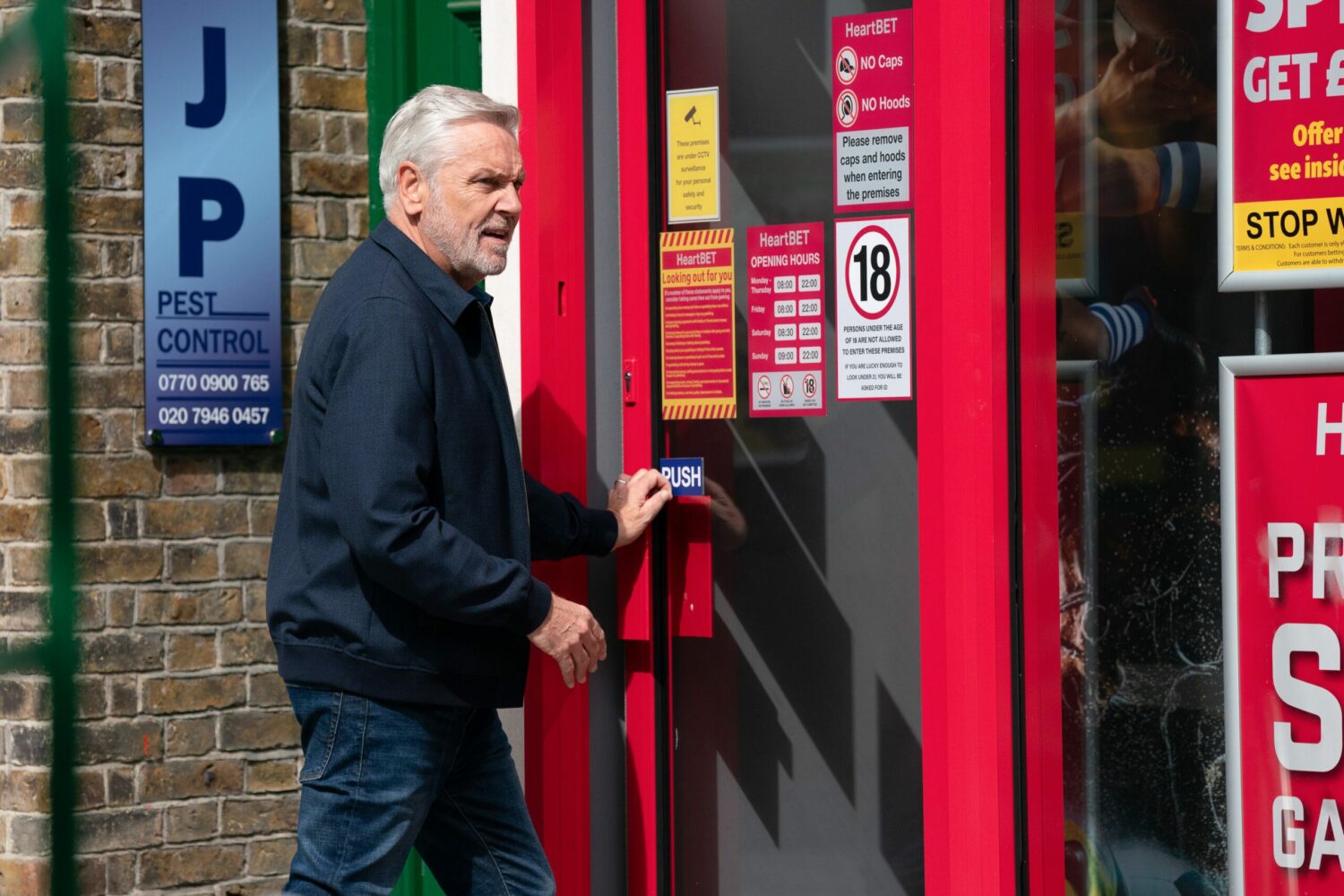 Rocky Cotton looks shifty as he goes into the bookies