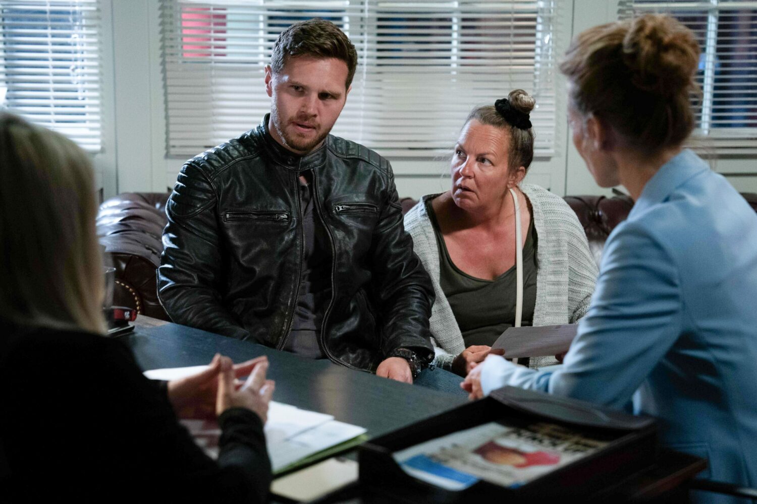 Keanu is furious while Karen looks at him questioningly in EastEnders