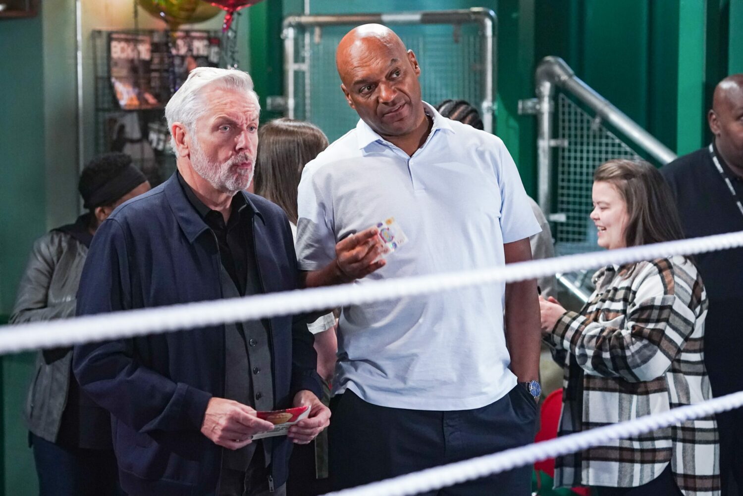 Rocky and George bet at the boxing match in EastEnders