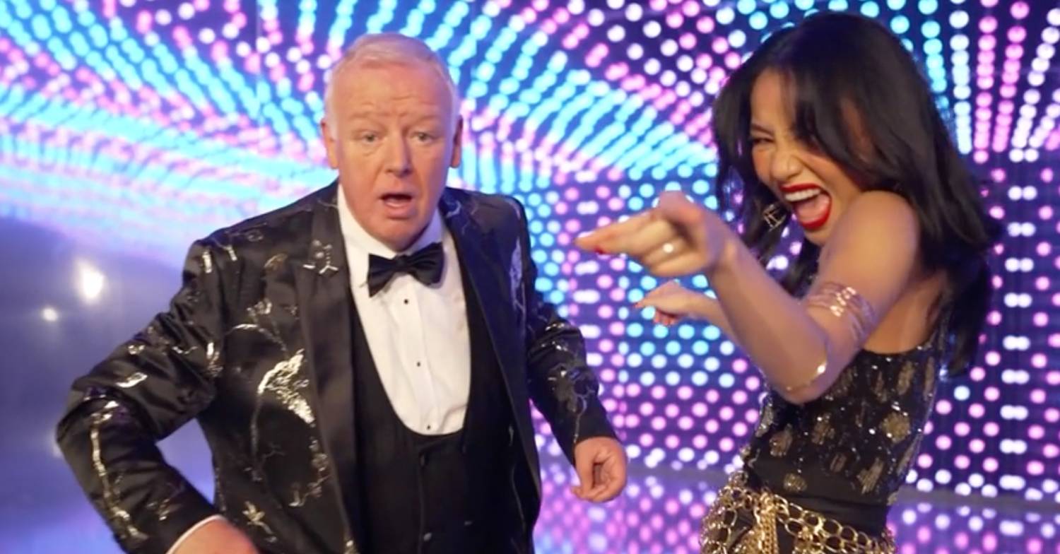 Les Dennis larks about with Nancy Xu