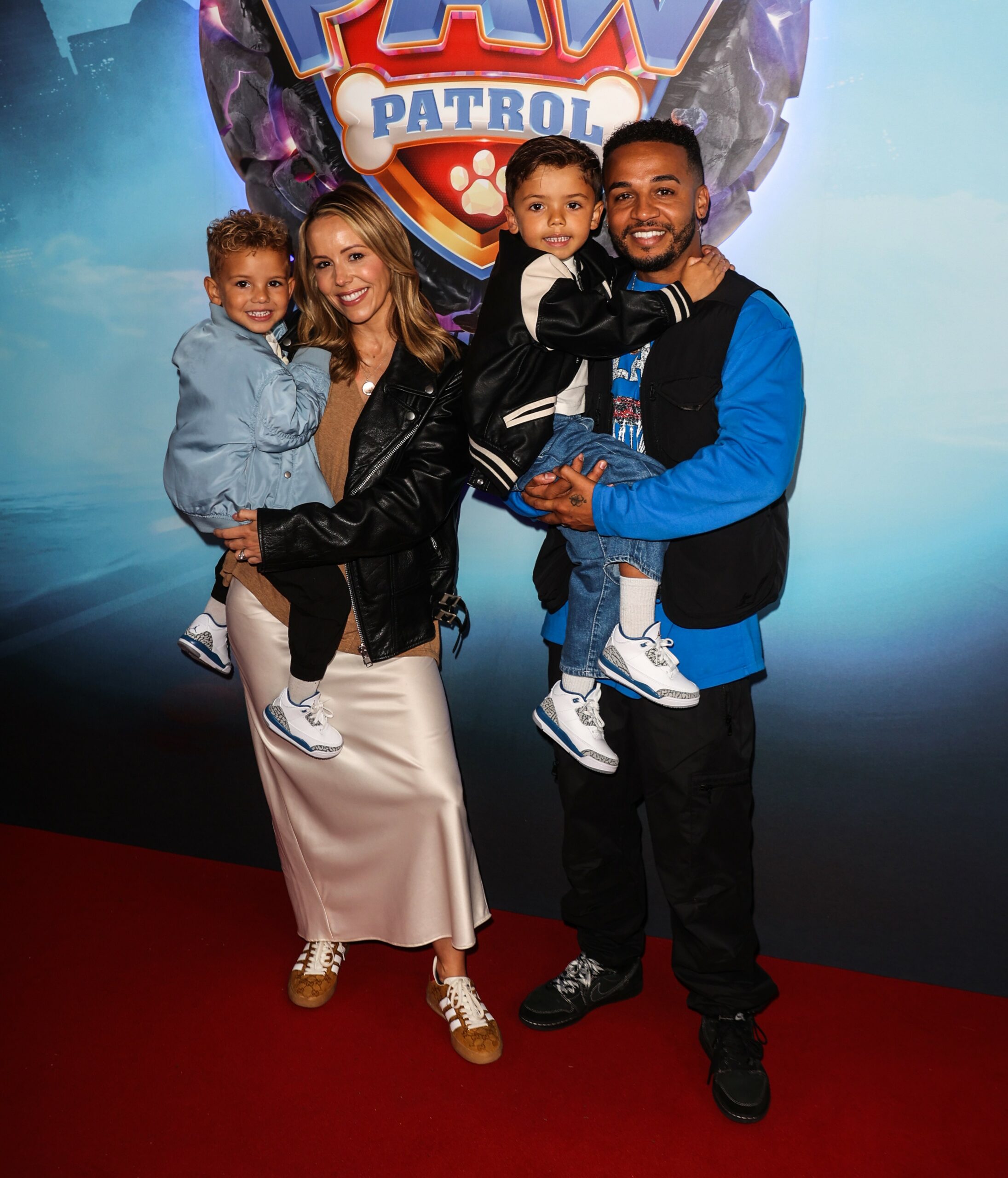 Aston Merrygold and his wife with their kids at event