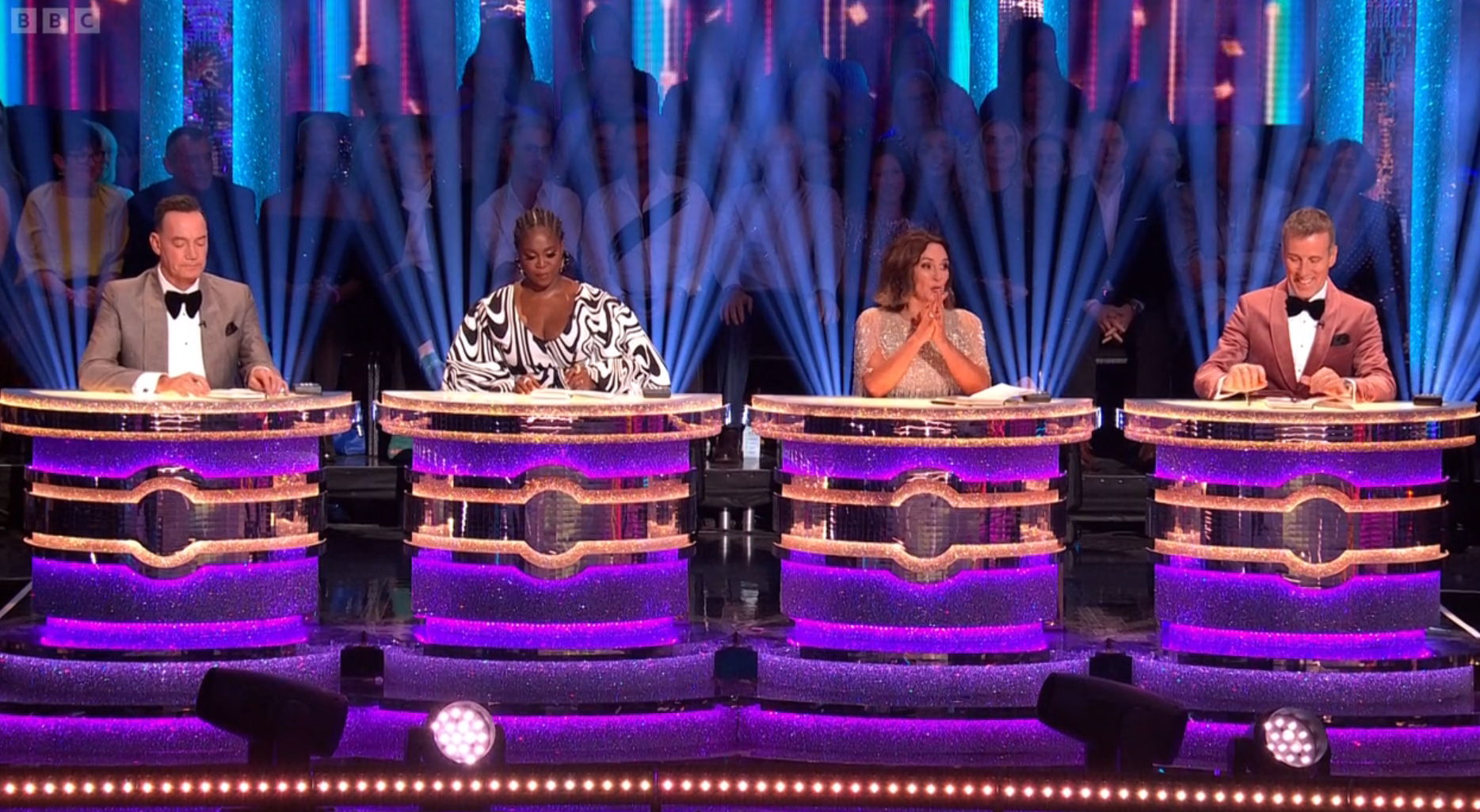 Strictly judges sit behind their desks before giving critique