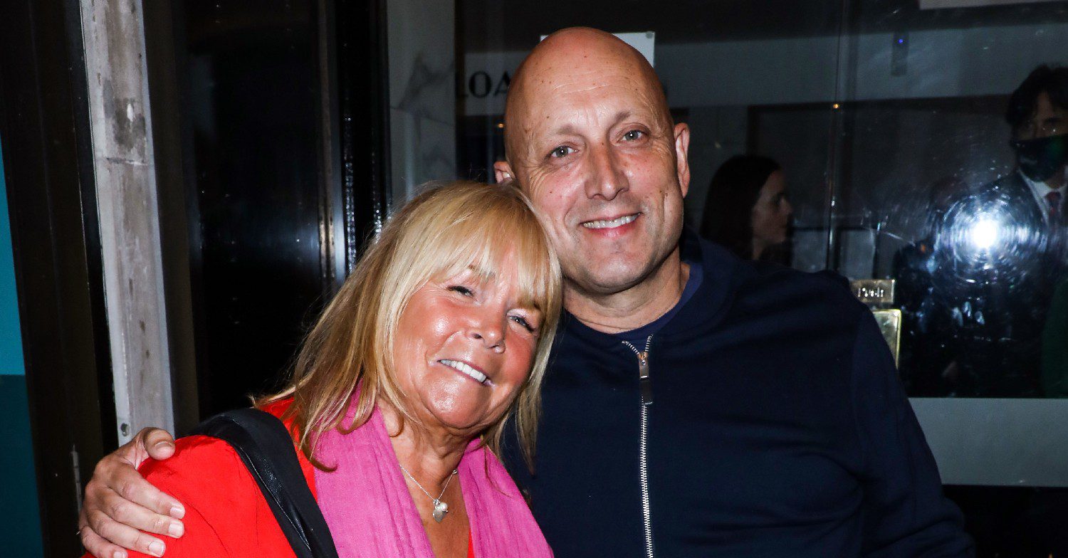 Linda Robson smiling with her husband Mark Dunford