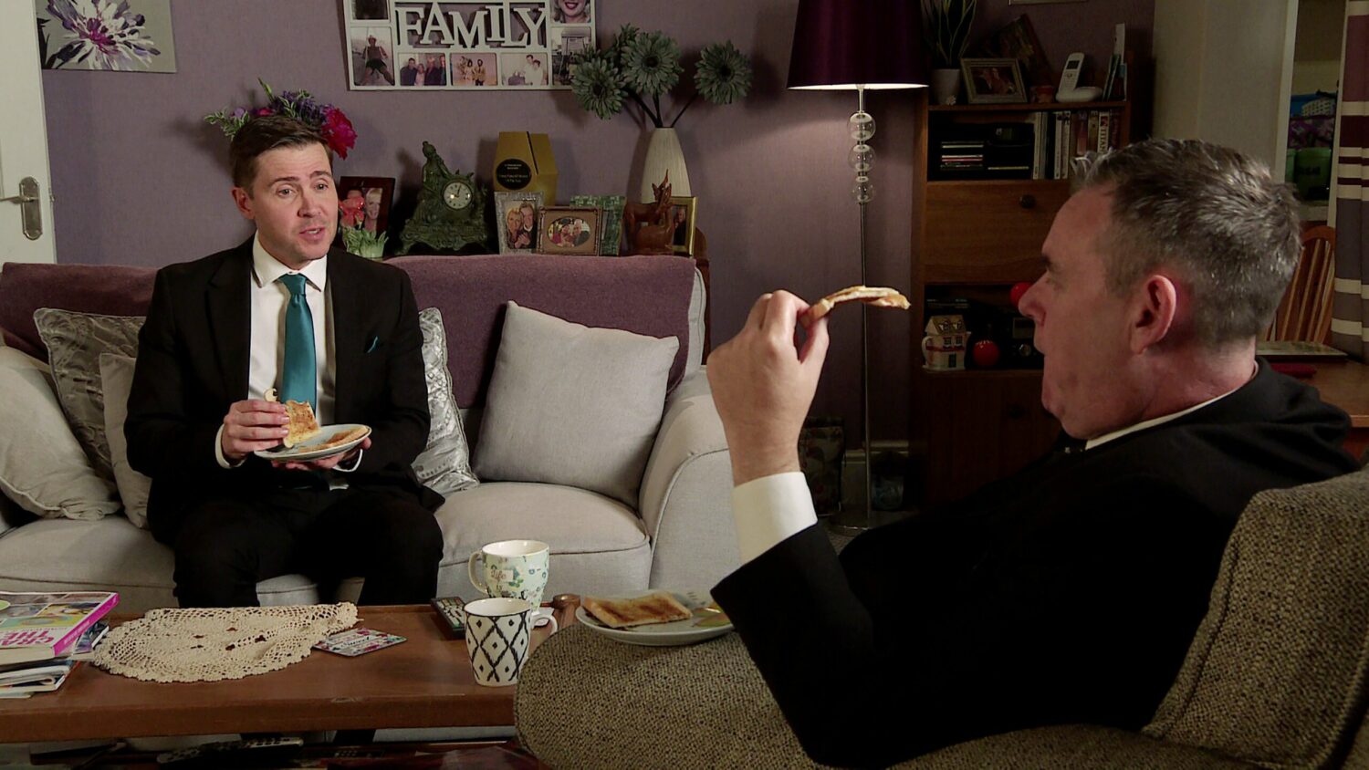 Corrie's Todd and George are speaking to each other and eating at home