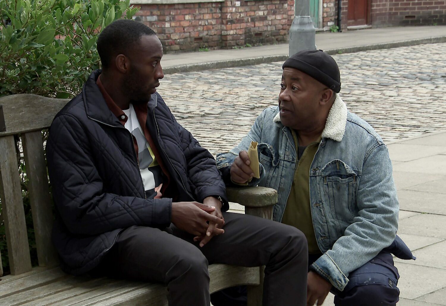 Coronation Street's Michael is sitting next to Ed outside