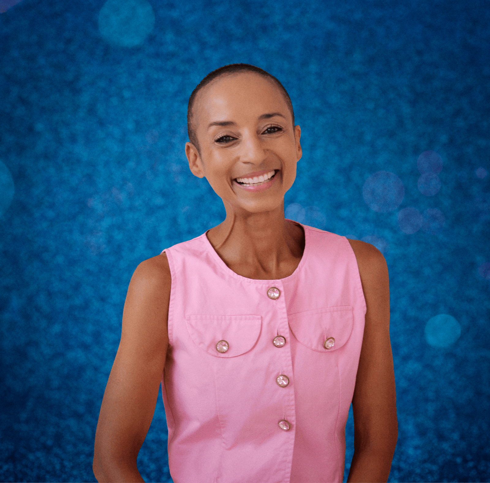 Adele Roberts smiling in a pink top