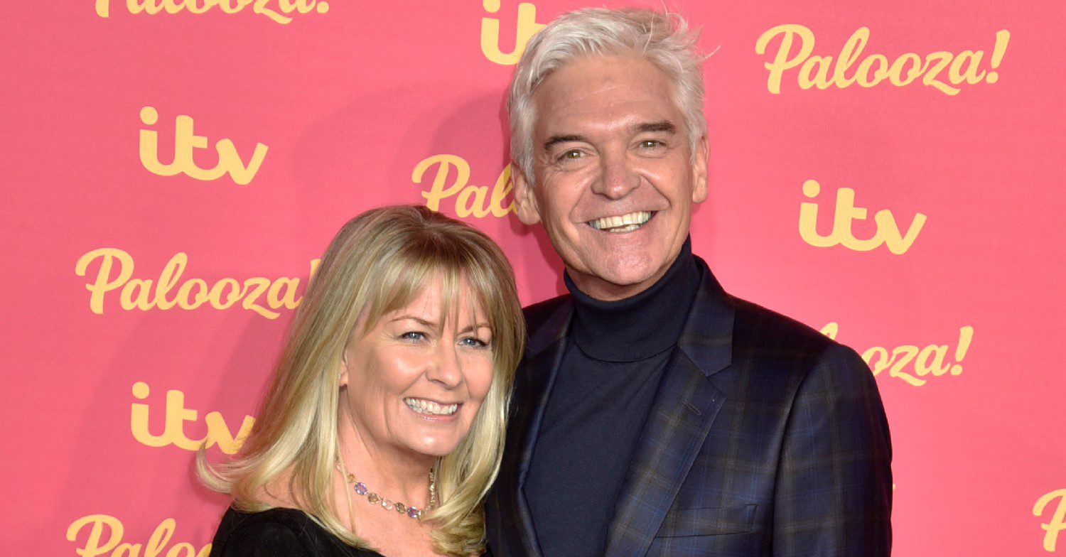 Phillip Schofield and wife smiling at ITV Palooza