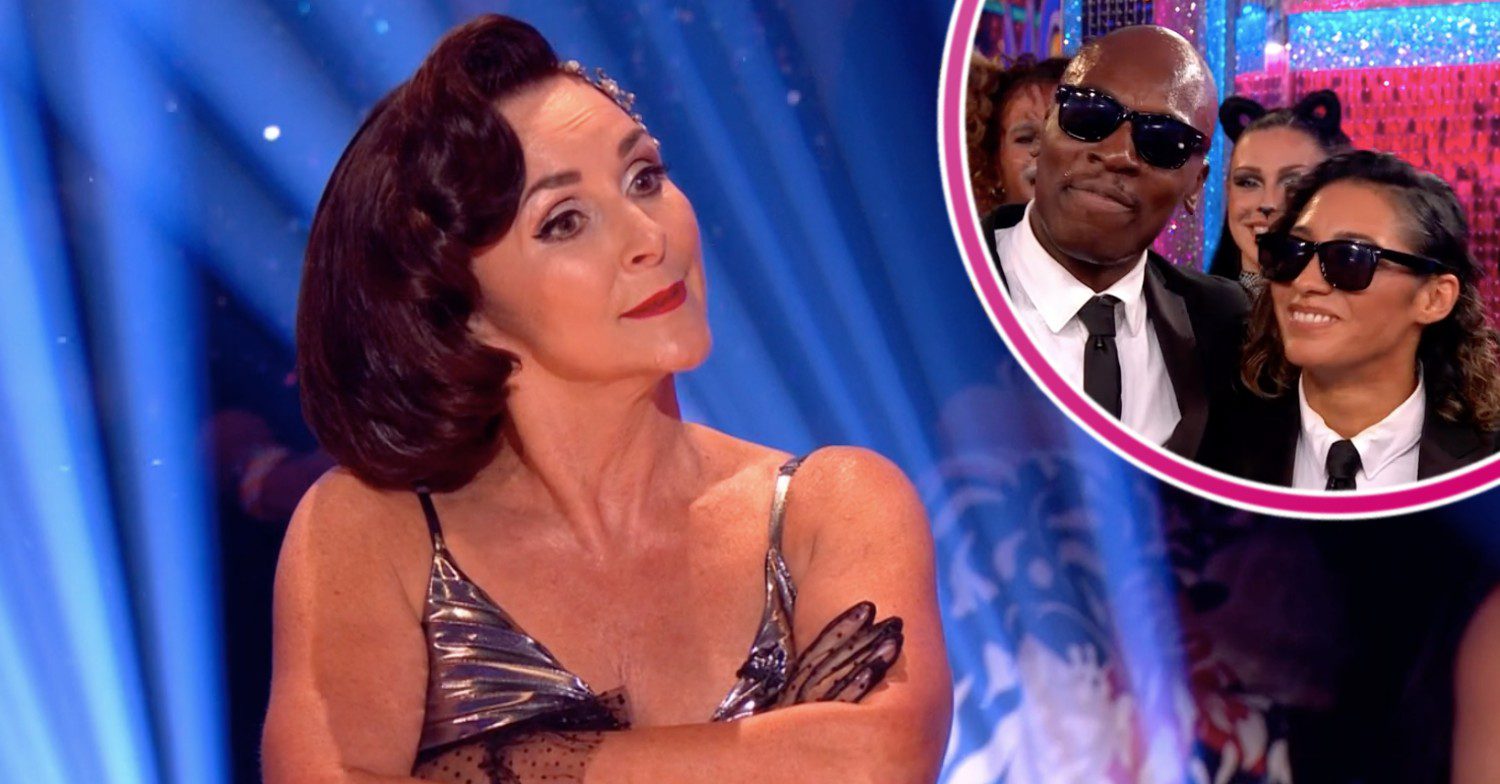 Shirley crossing her arms with Eddie and Karen