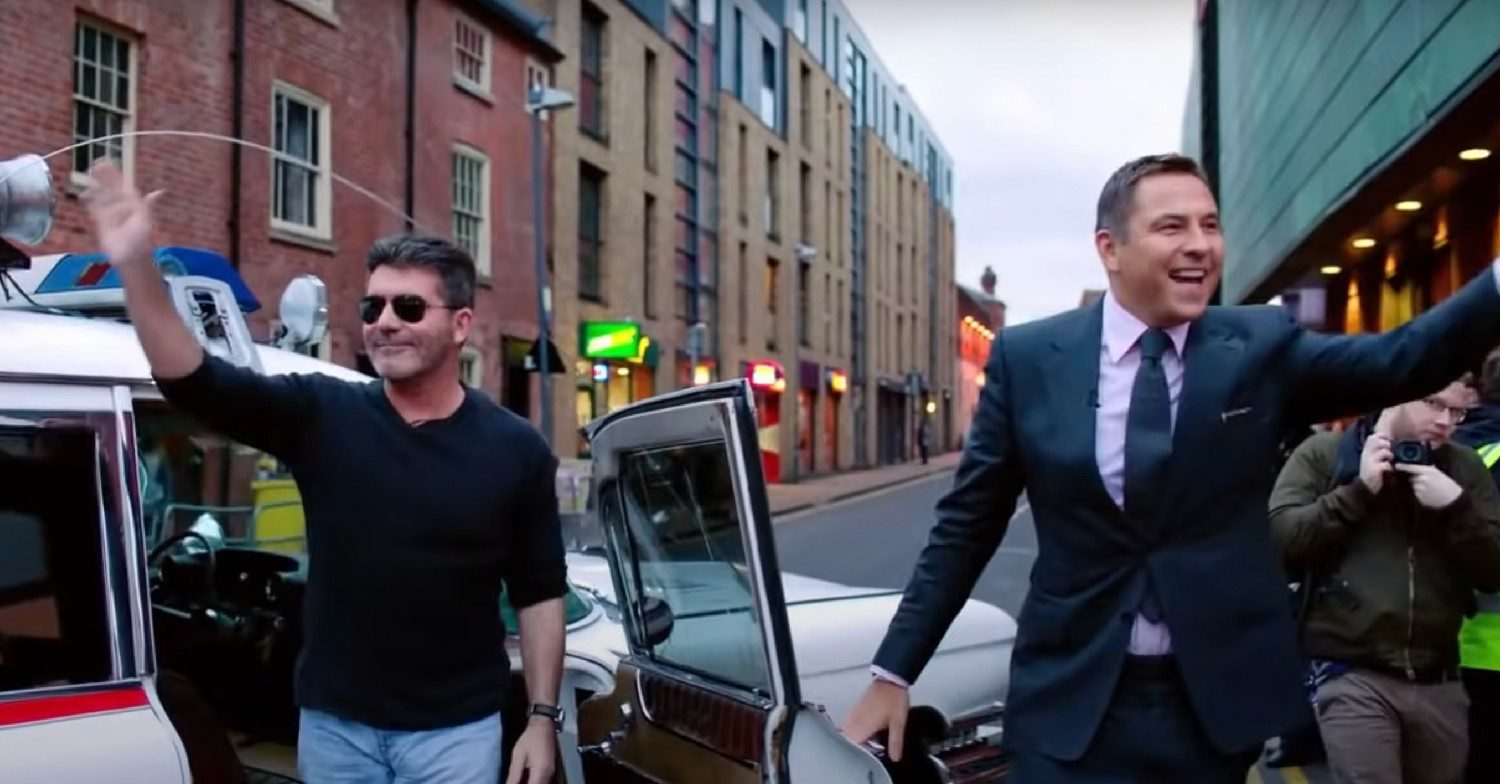 Simon Cowell and David Walliams waving as they arrive at a recording of Britain's Got Talent