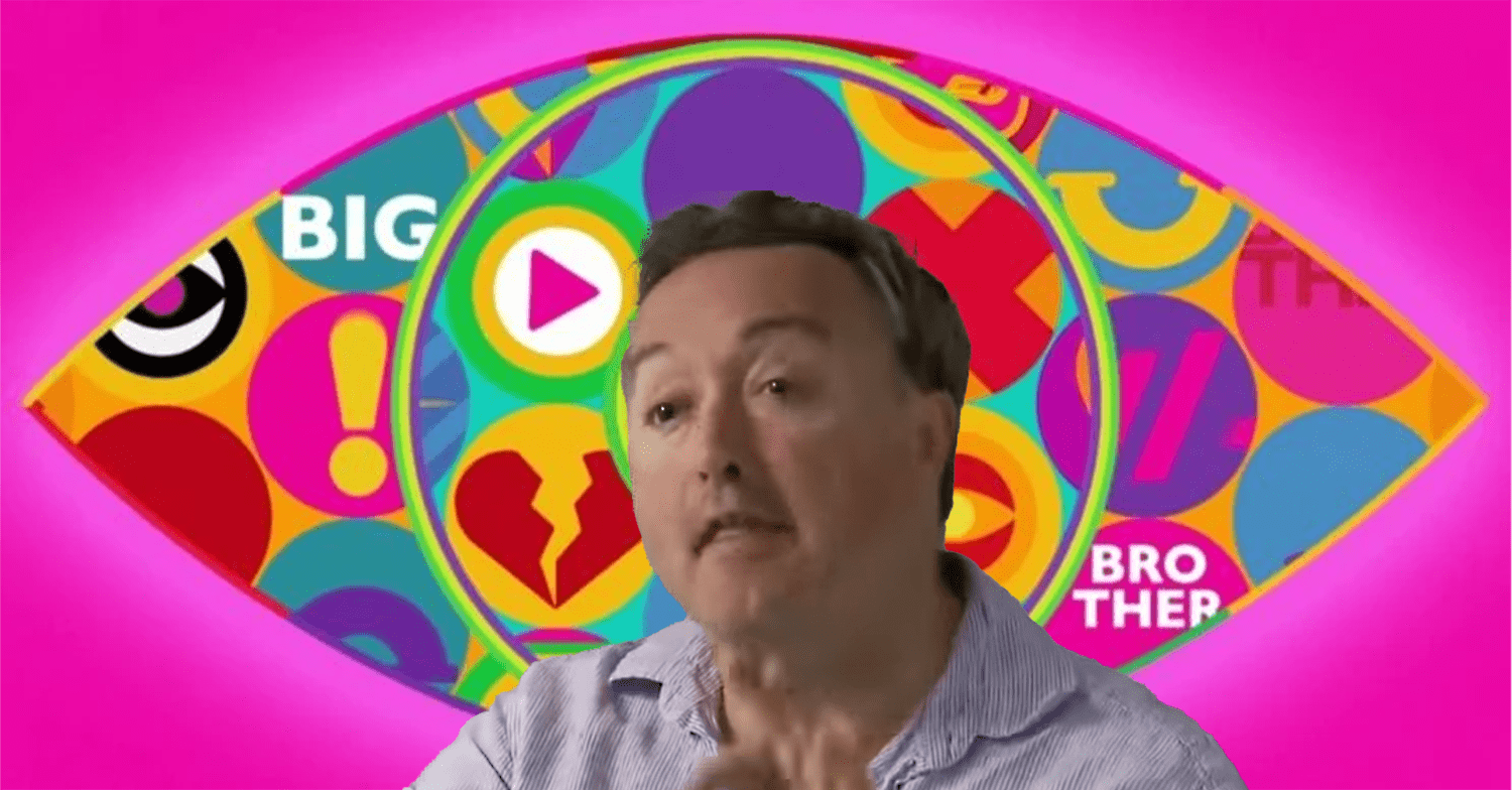 Marcus Bentley in front of the Big Brother logo