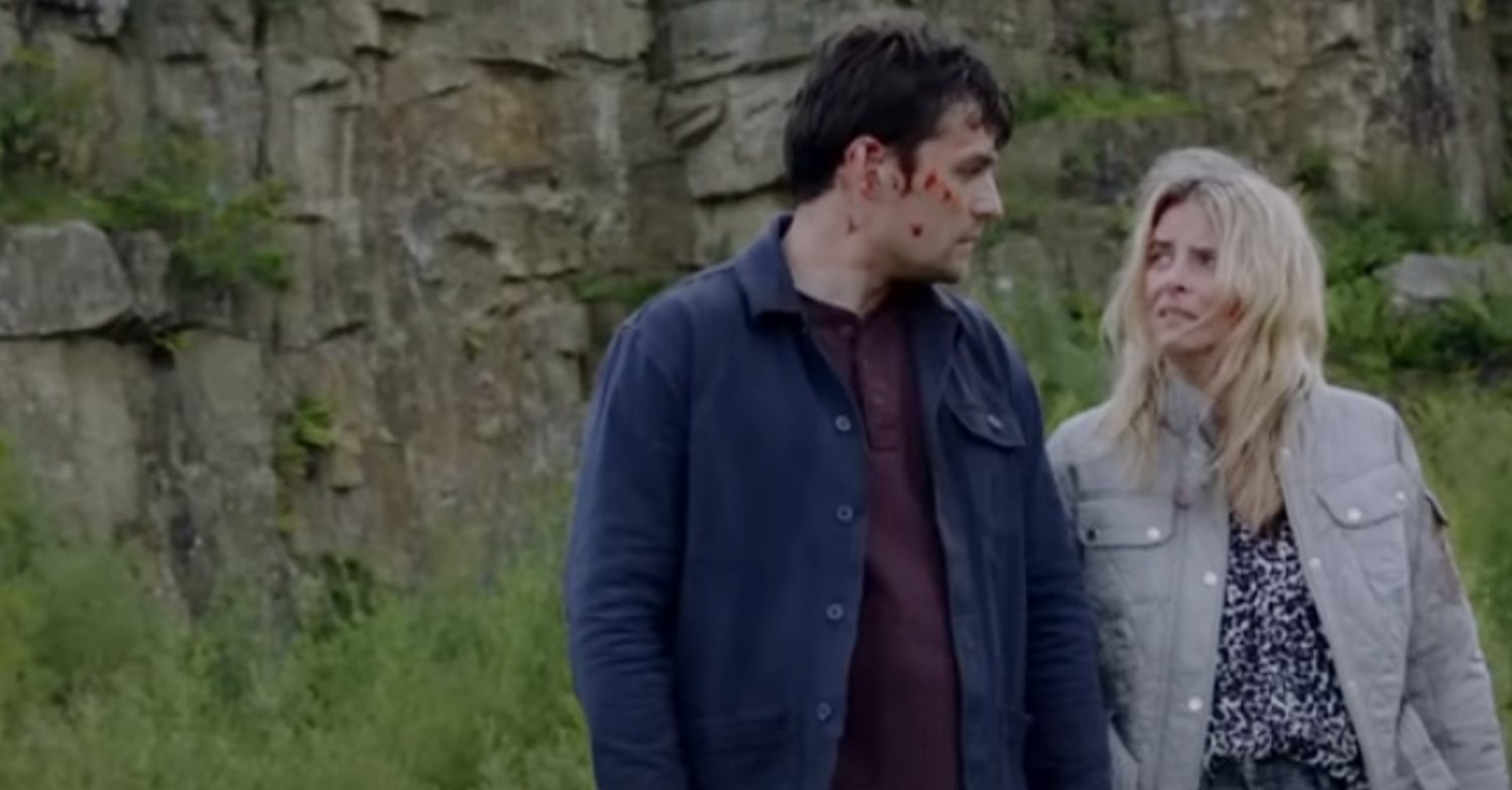 Emmerdale's Mack and Charity are looking at each other with sadness