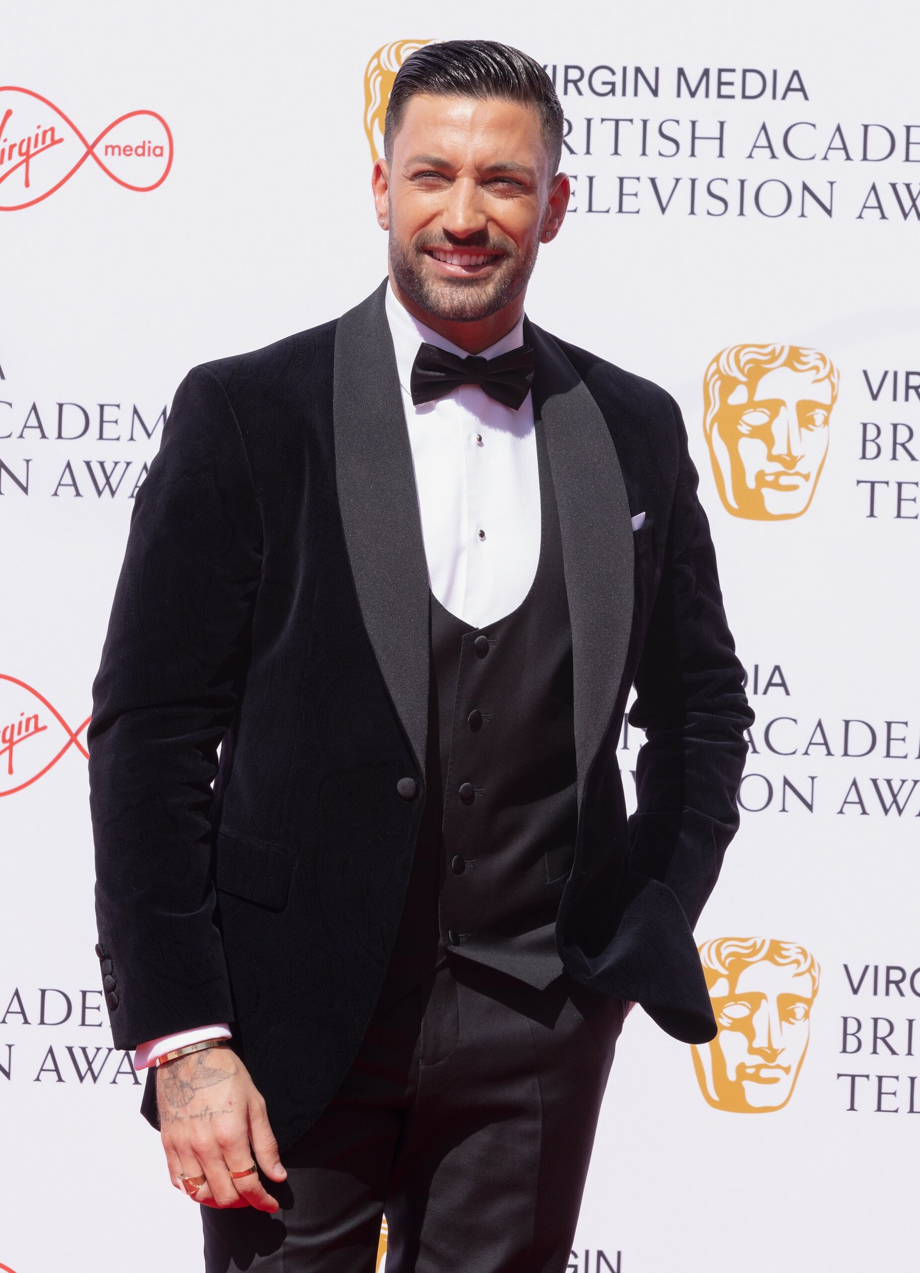 Strictly pro Giovanni Pernice smiling at the BAFTAs