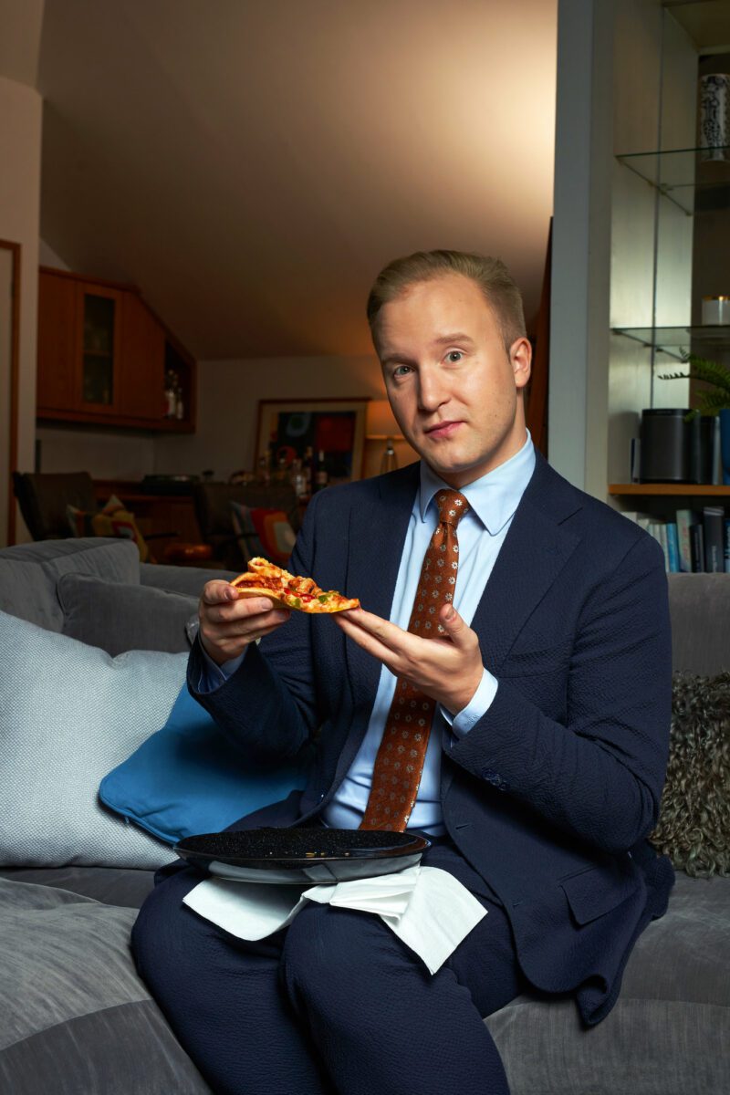 William Hanson holding a pizza