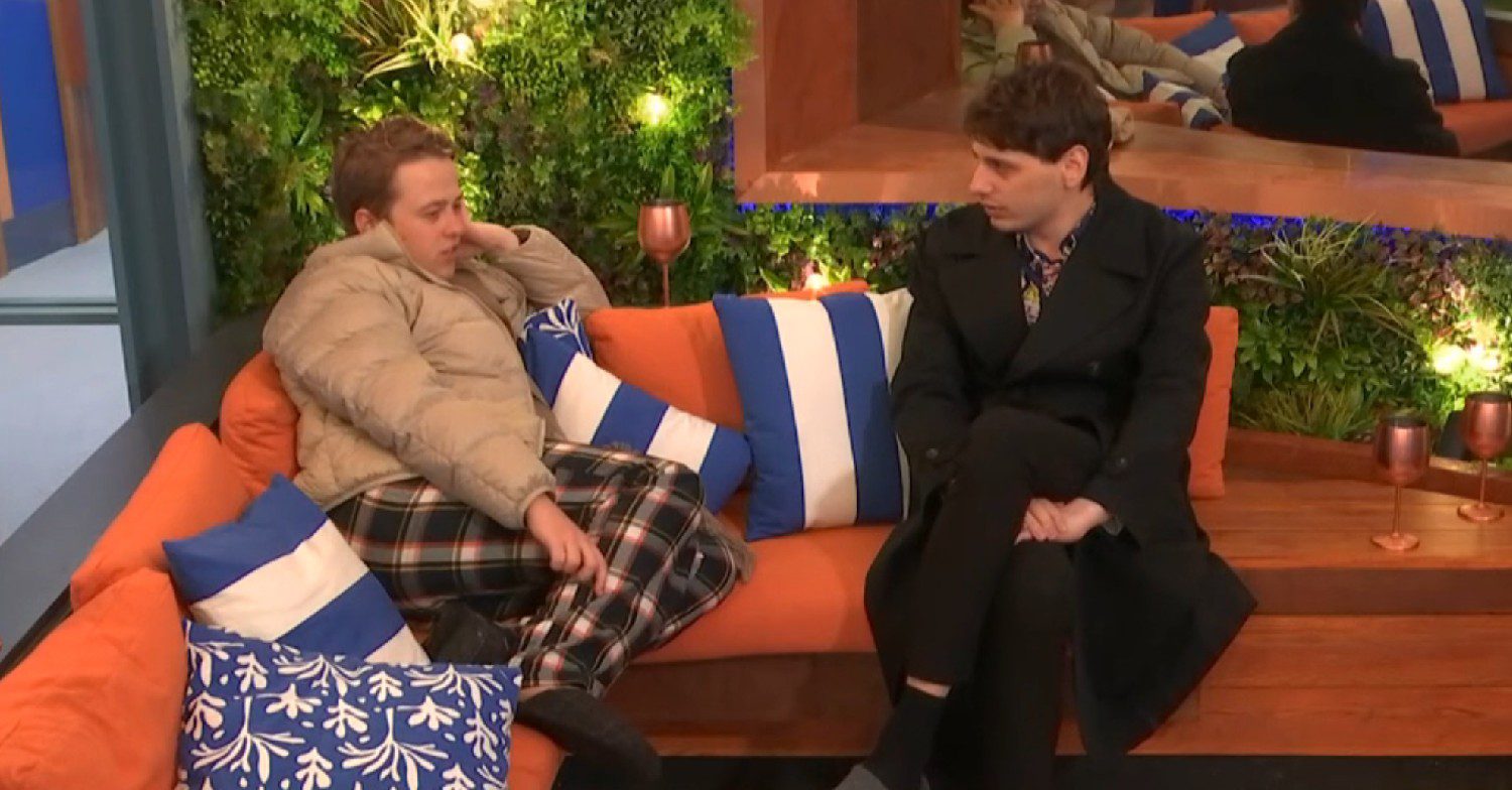 Big Brother housemates Henry and Jordan sitting in the garden