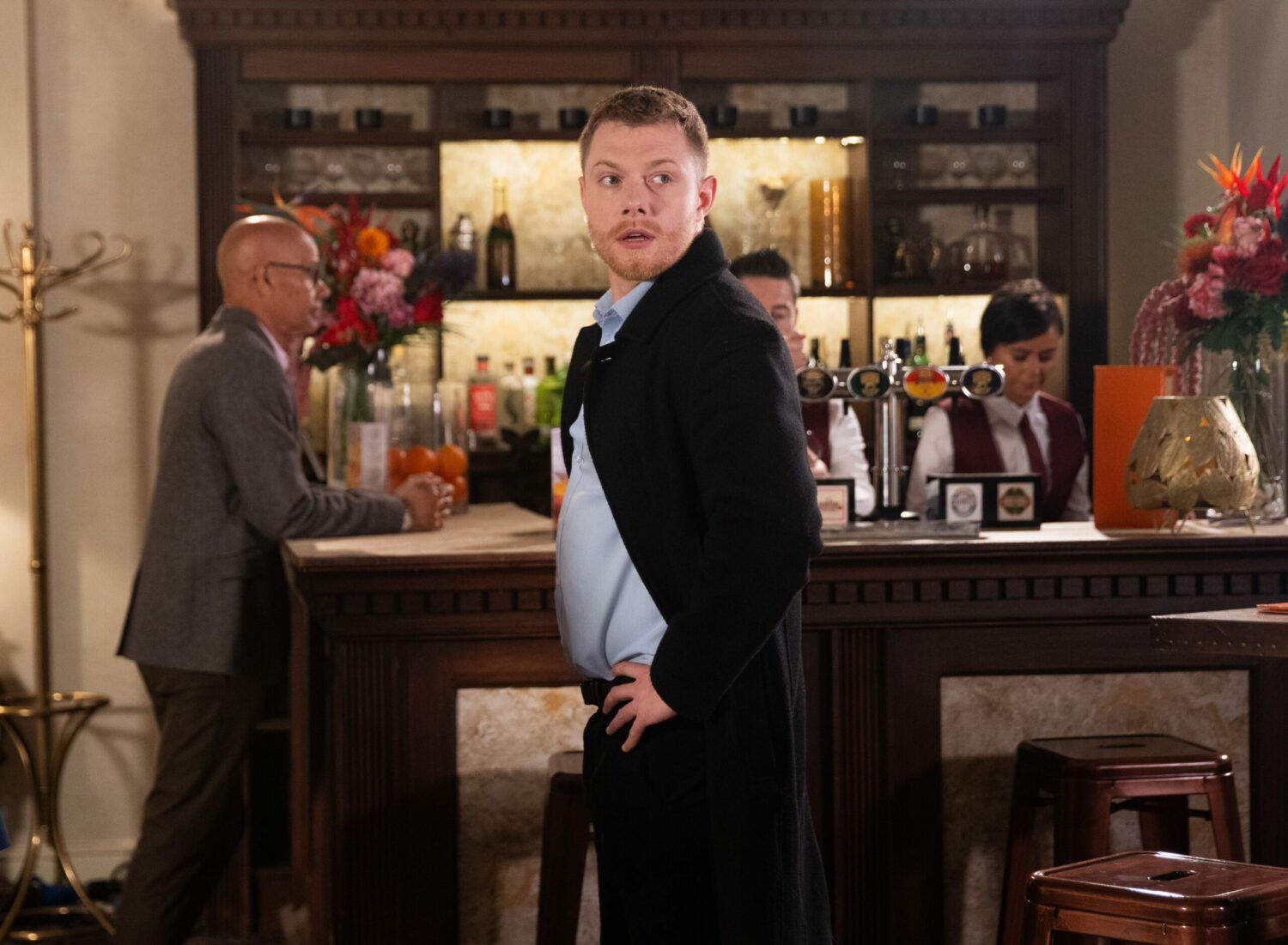 Daniel in a bar on Corrie, looking worried (Credit: ITV)