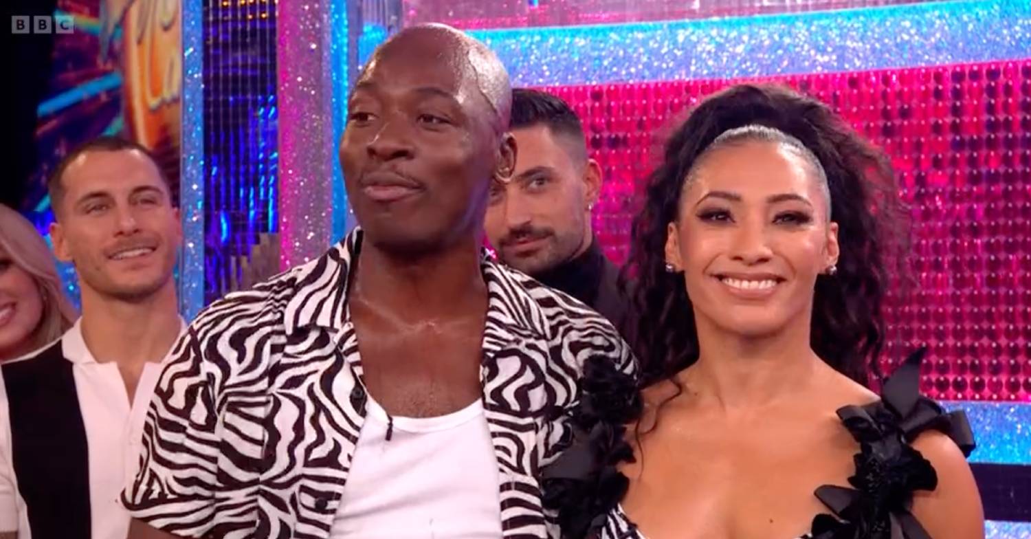 Eddie Kadi and Karen smile